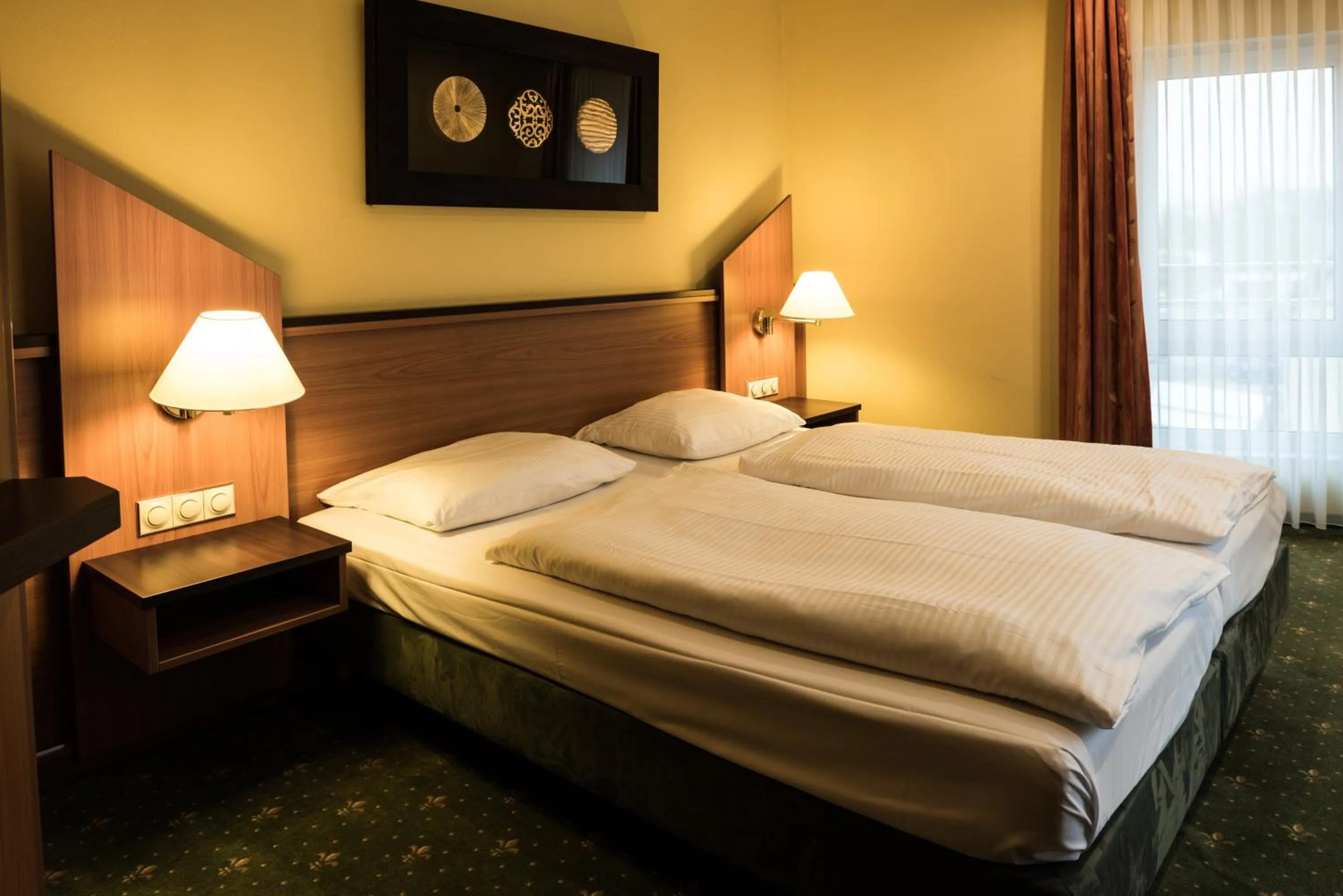 Photo of the whole room, Bed in Hotel Sperling mit E-Ladestation