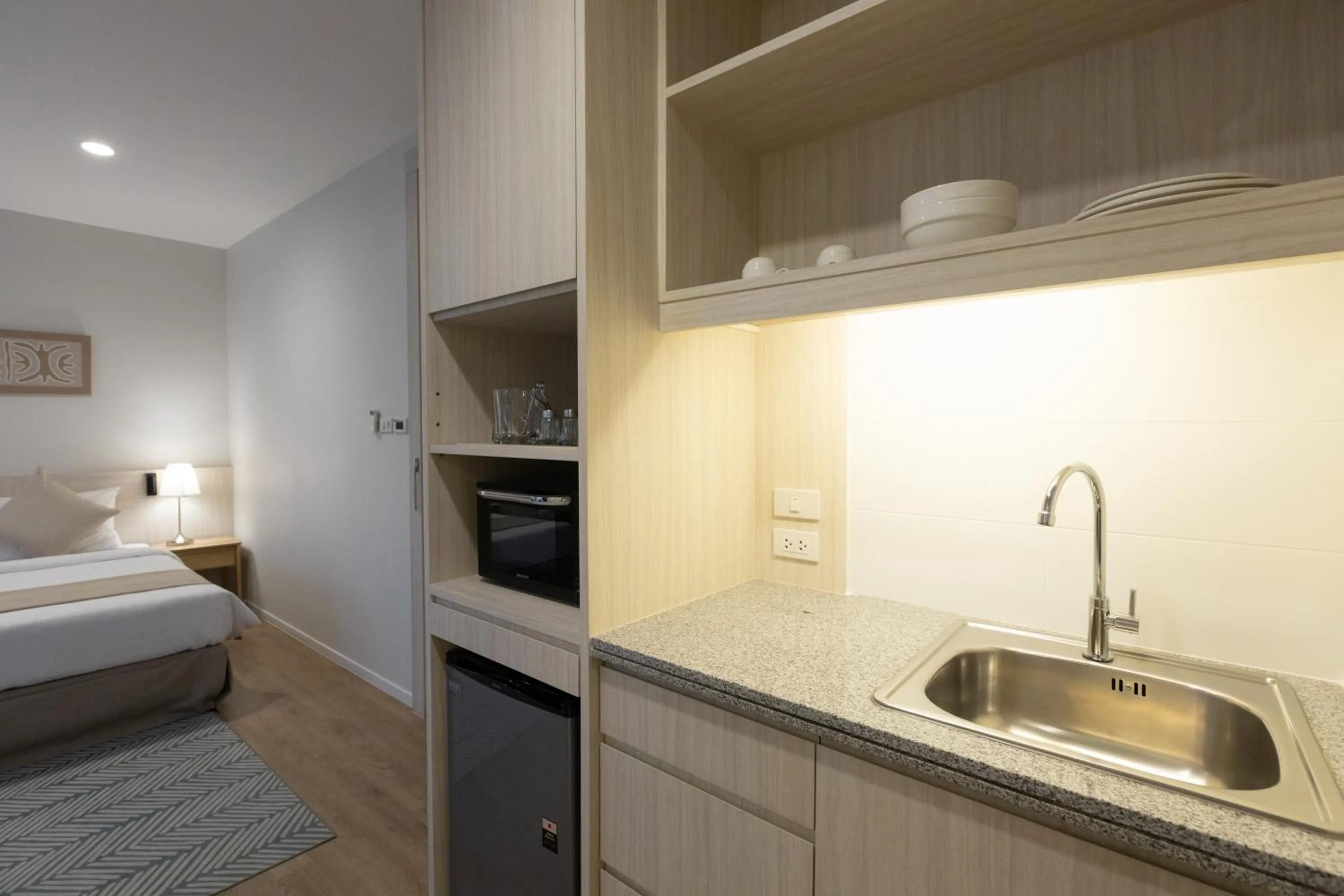 Kitchen or kitchenette, Bed in Kantary Hotel Banchang