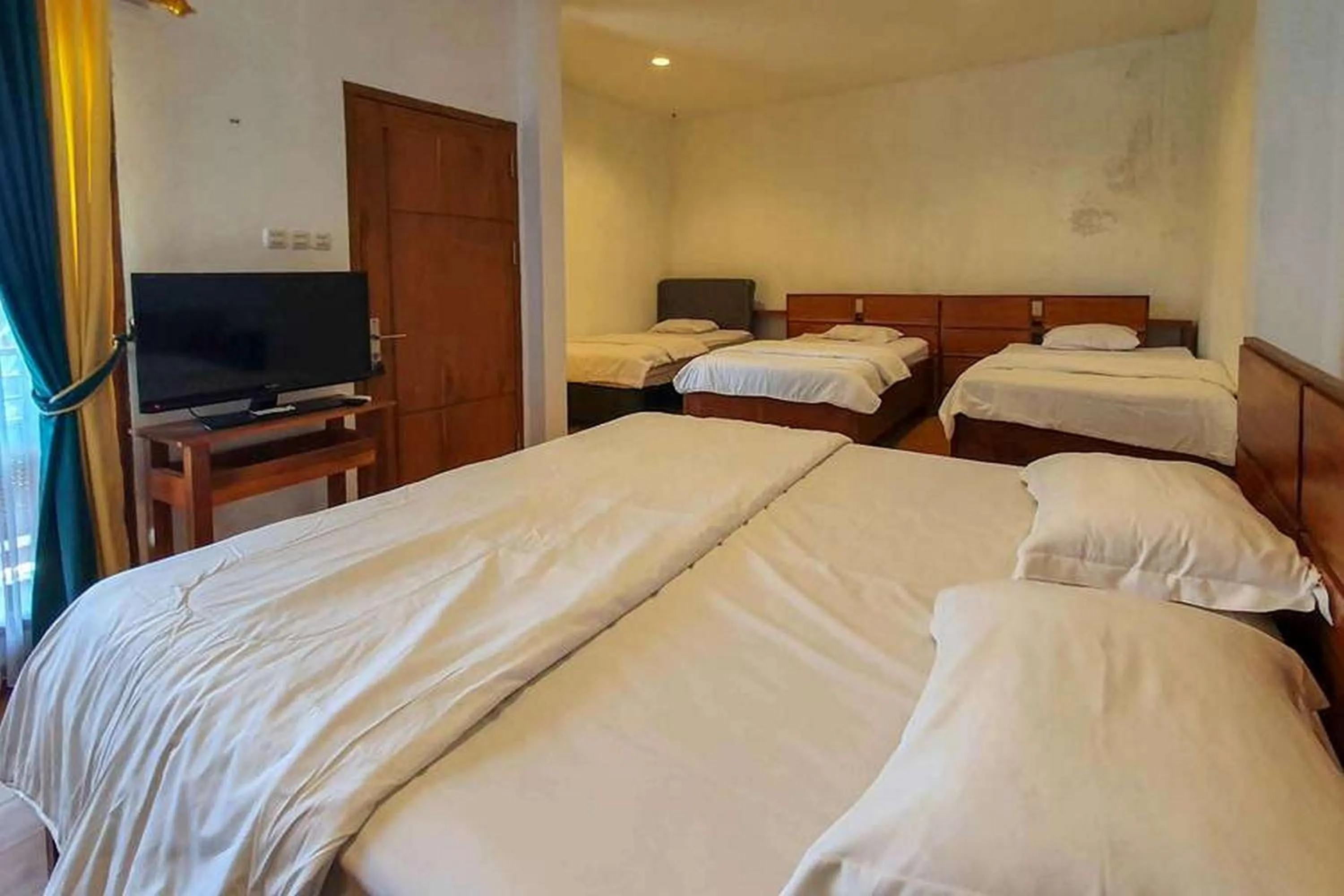 Bed in Rumah Eyang Tardjo Syariah Mitra RedDoorz