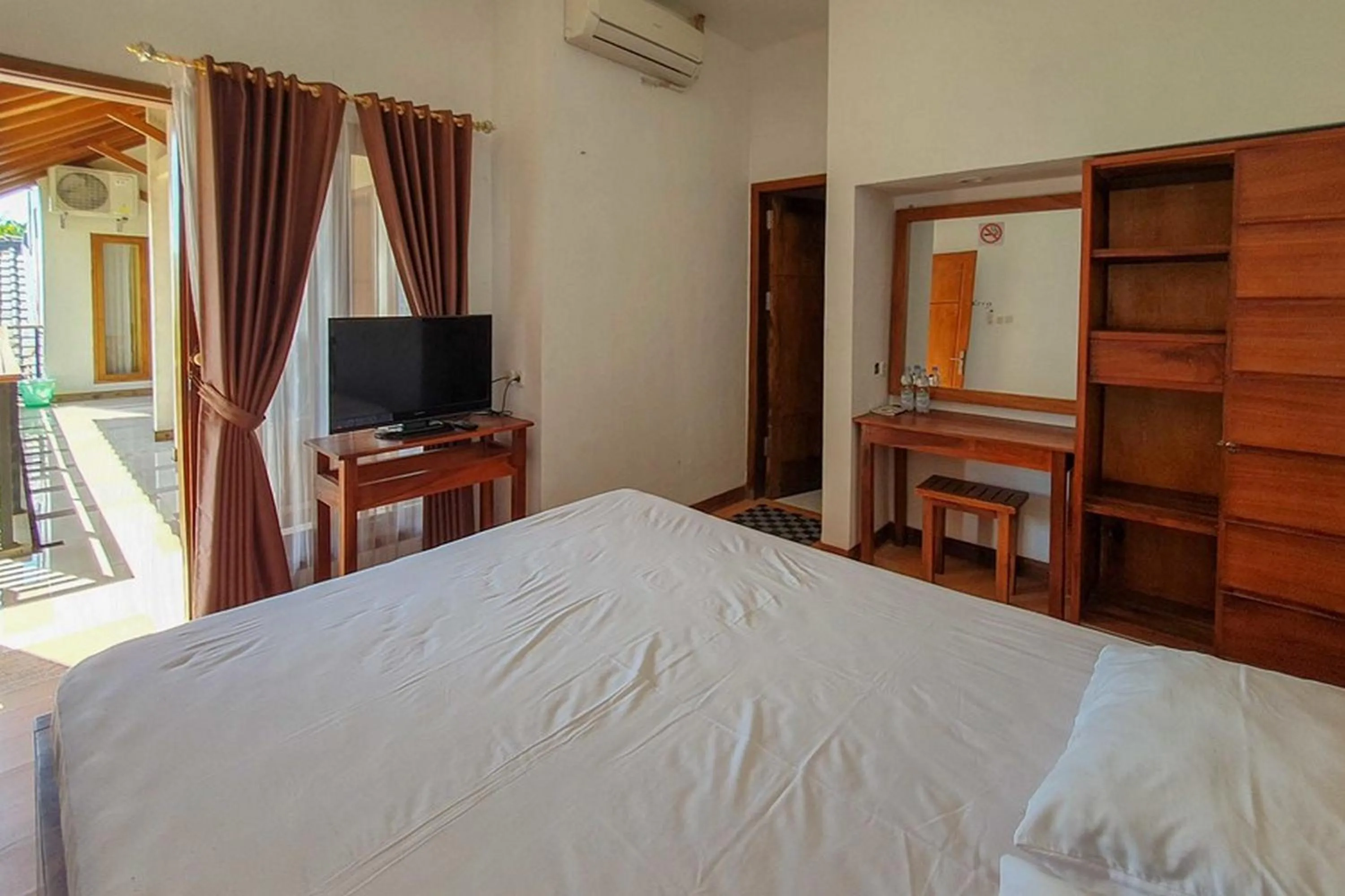 Bed in Rumah Eyang Tardjo Syariah Mitra RedDoorz