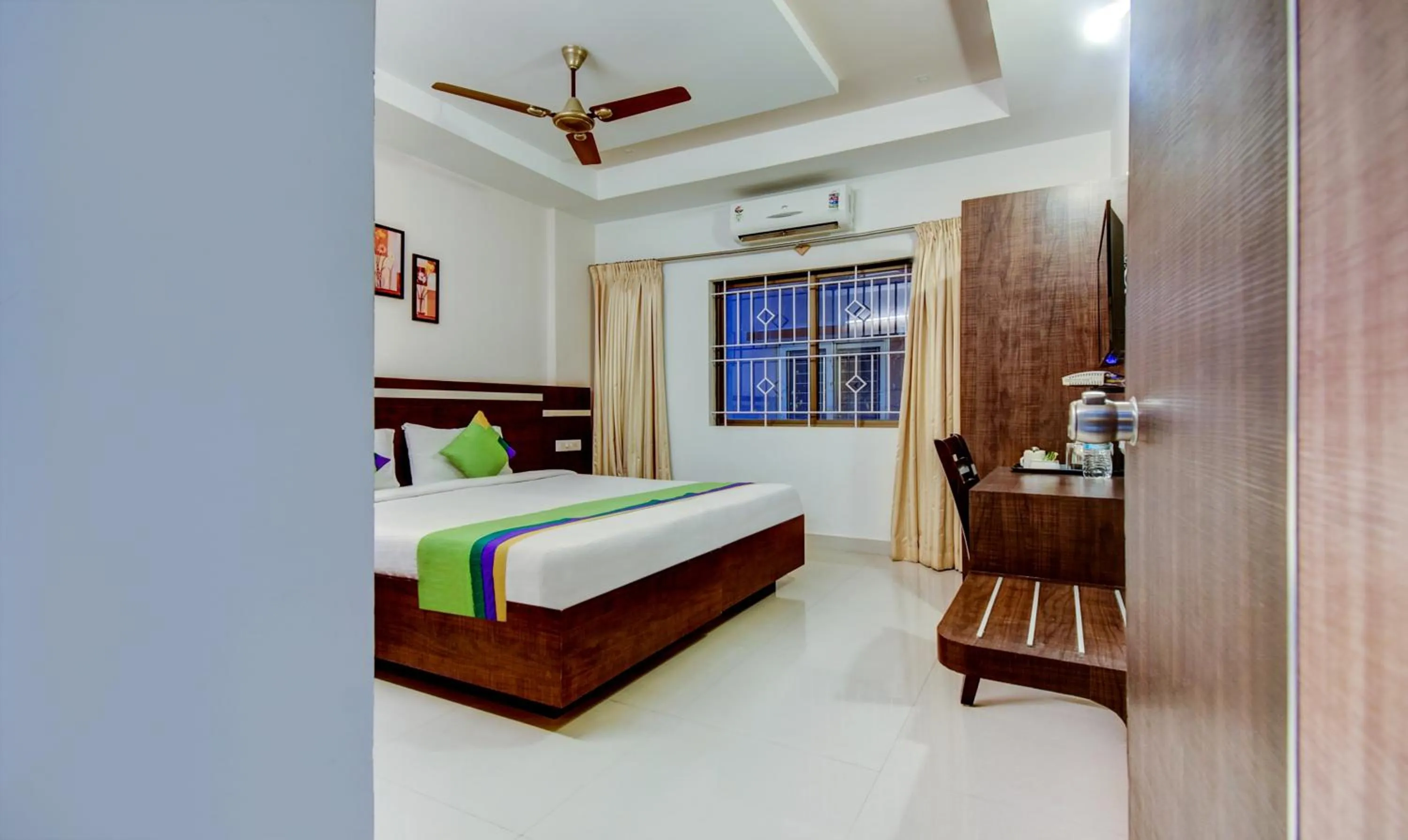 Bedroom, Bed in Treebo Primeland Suites