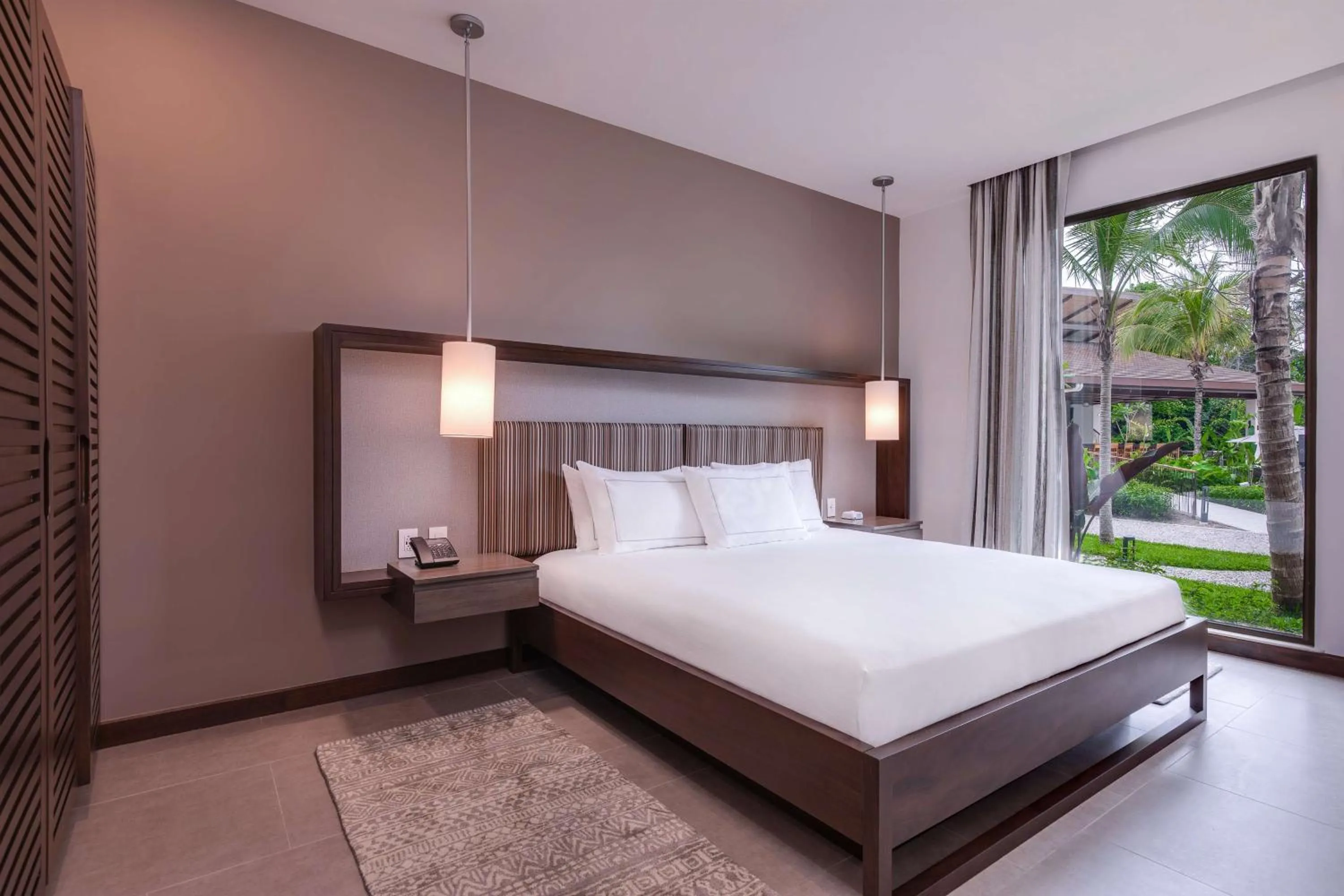 Bed in Botanika Osa Peninsula, Curio Collection By Hilton