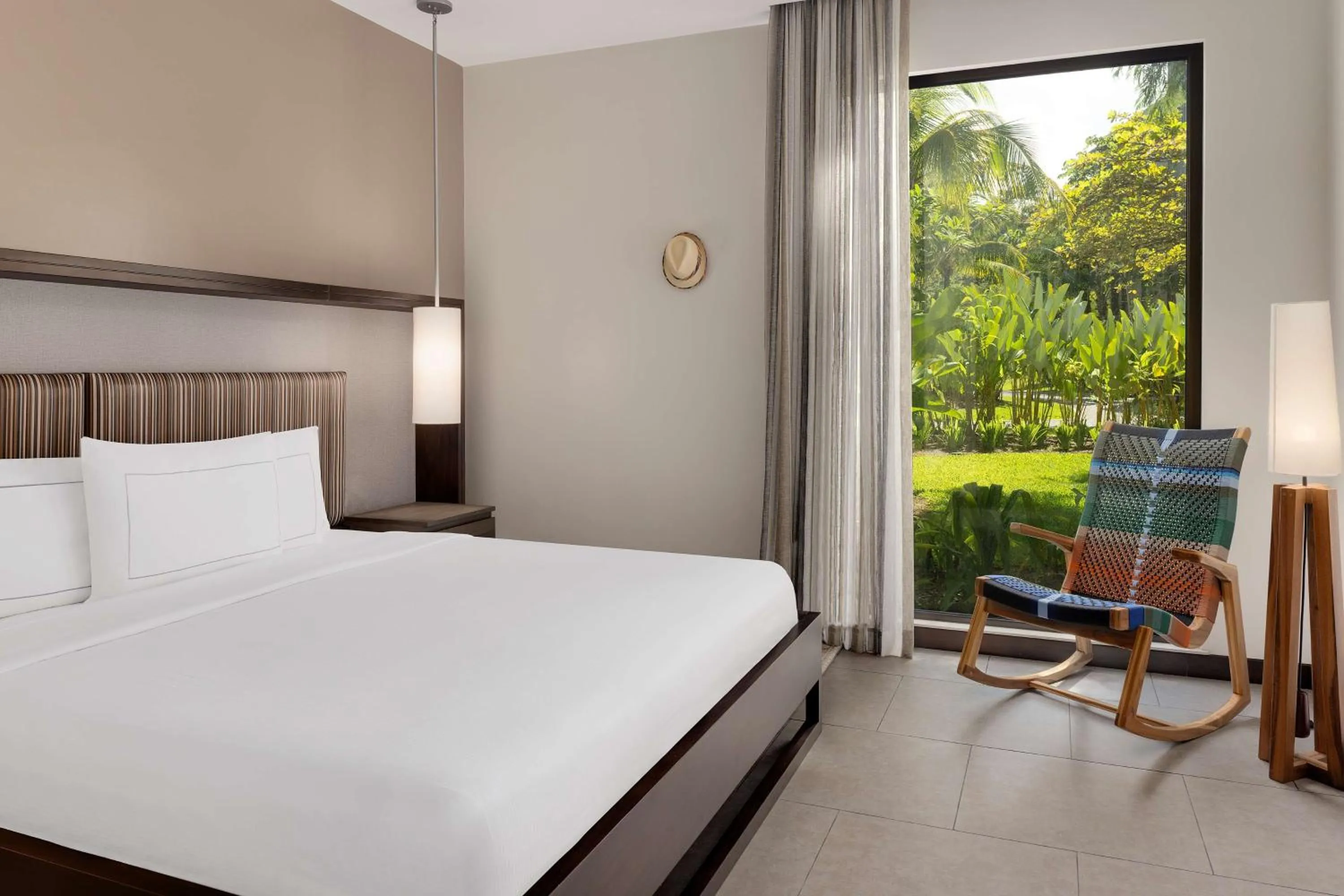 Bed in Botanika Osa Peninsula, Curio Collection By Hilton