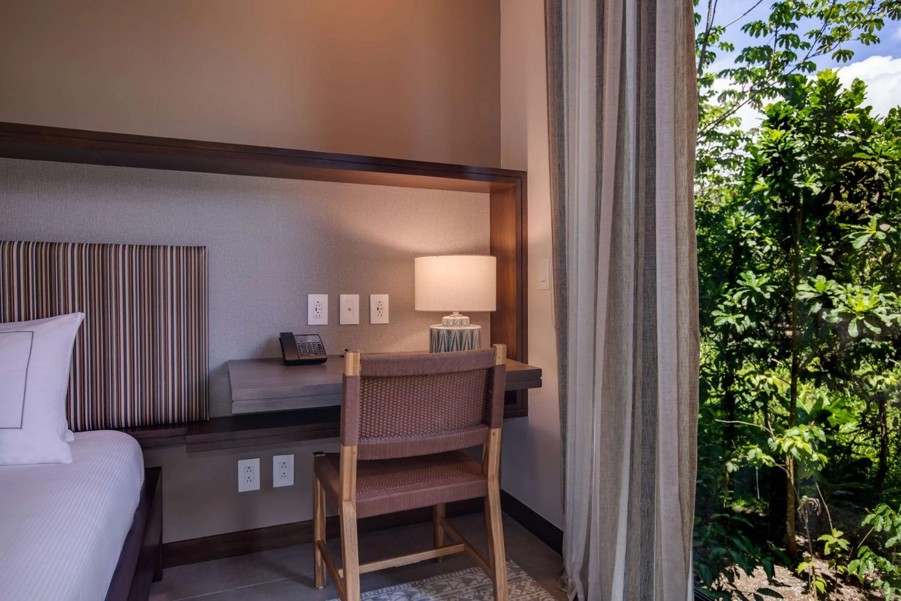 Bed in Botanika Osa Peninsula, Curio Collection By Hilton