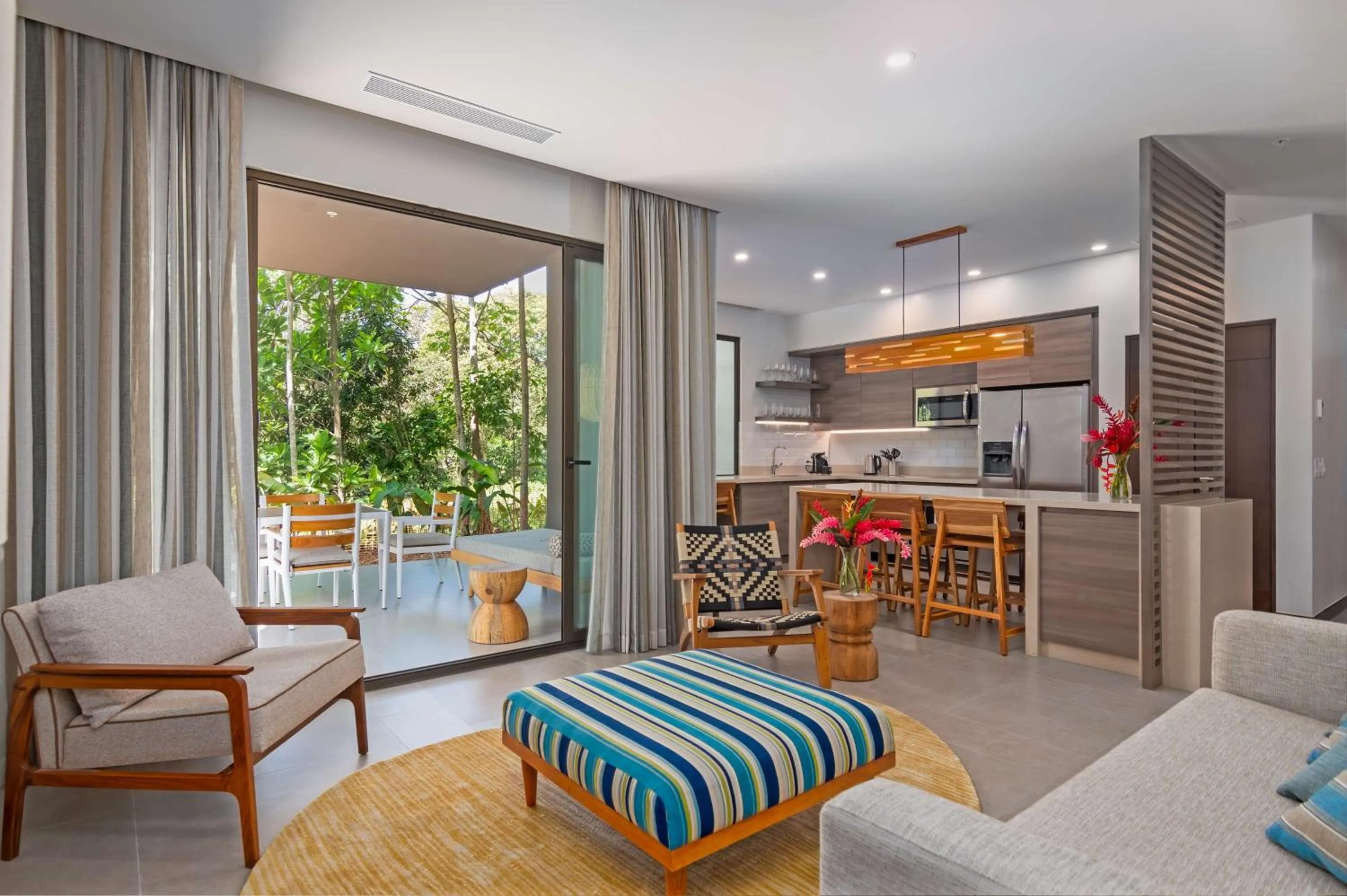 Living room in Botanika Osa Peninsula, Curio Collection By Hilton