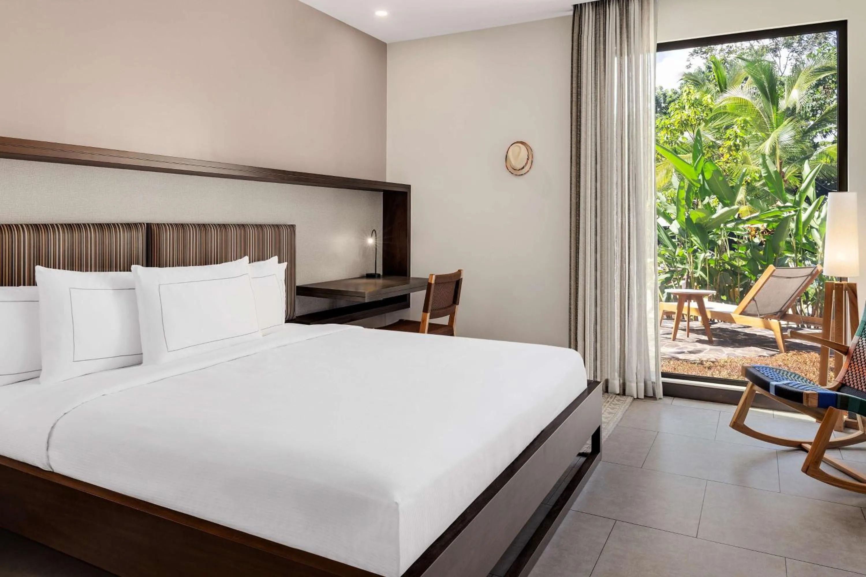 Bed in Botanika Osa Peninsula, Curio Collection By Hilton