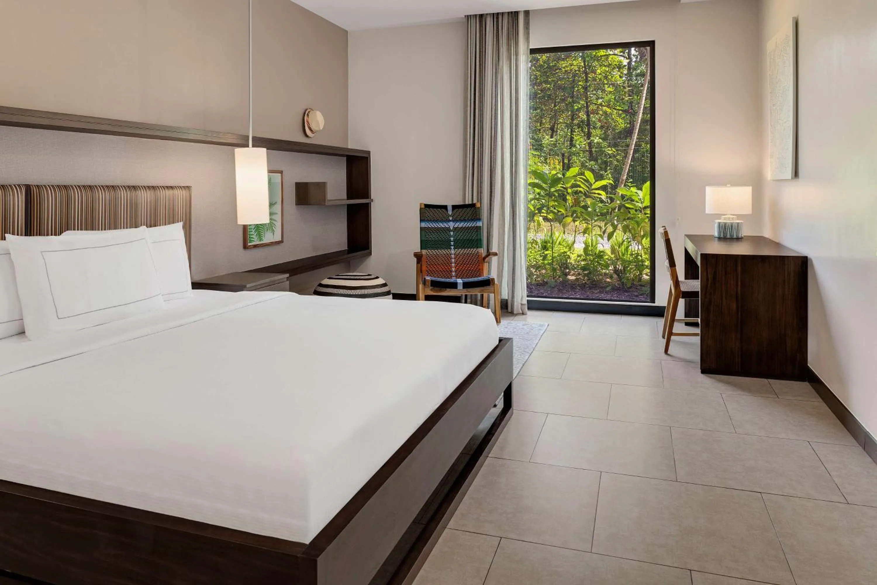 Bed in Botanika Osa Peninsula, Curio Collection By Hilton