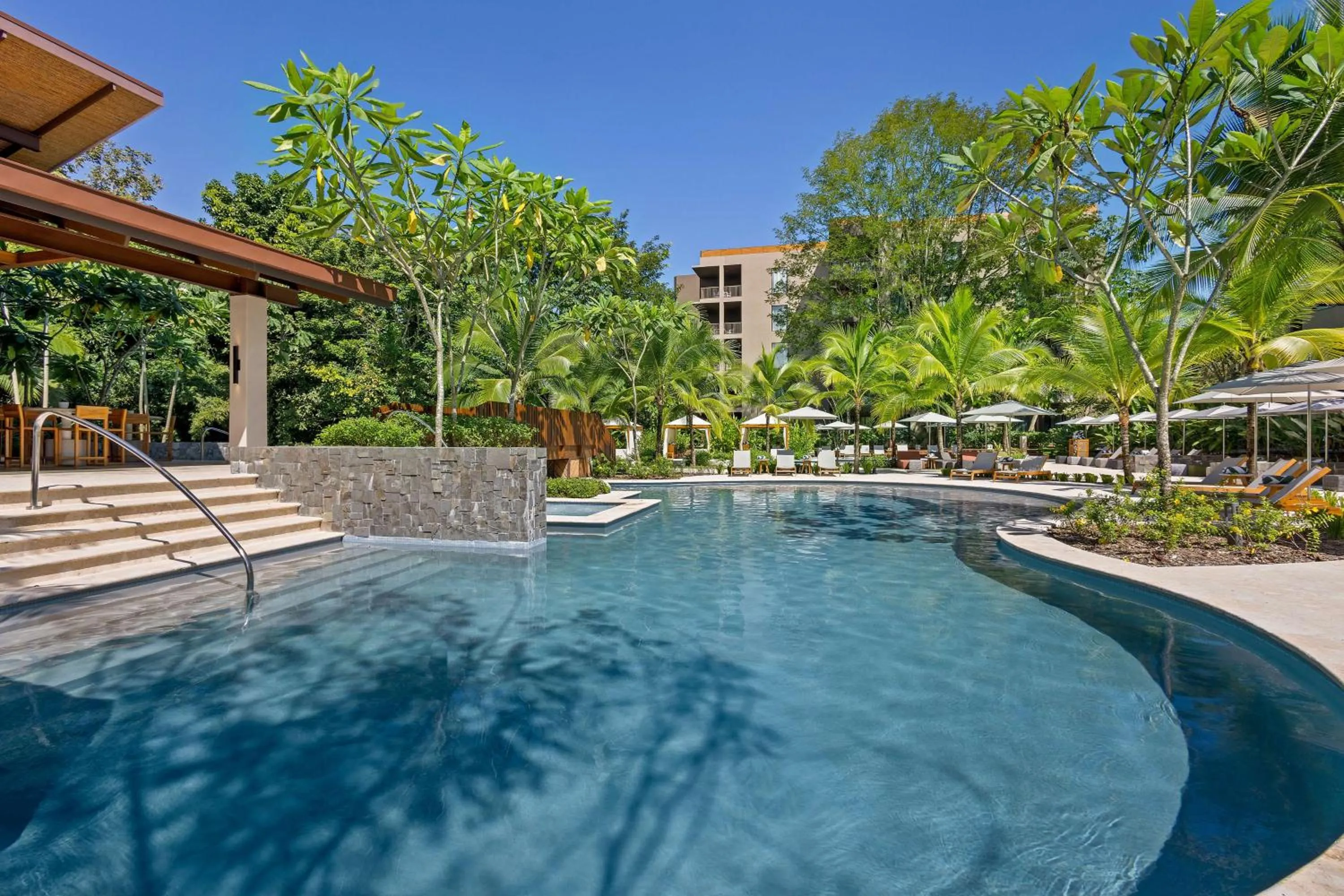 Pool view in Botanika Osa Peninsula, Curio Collection By Hilton