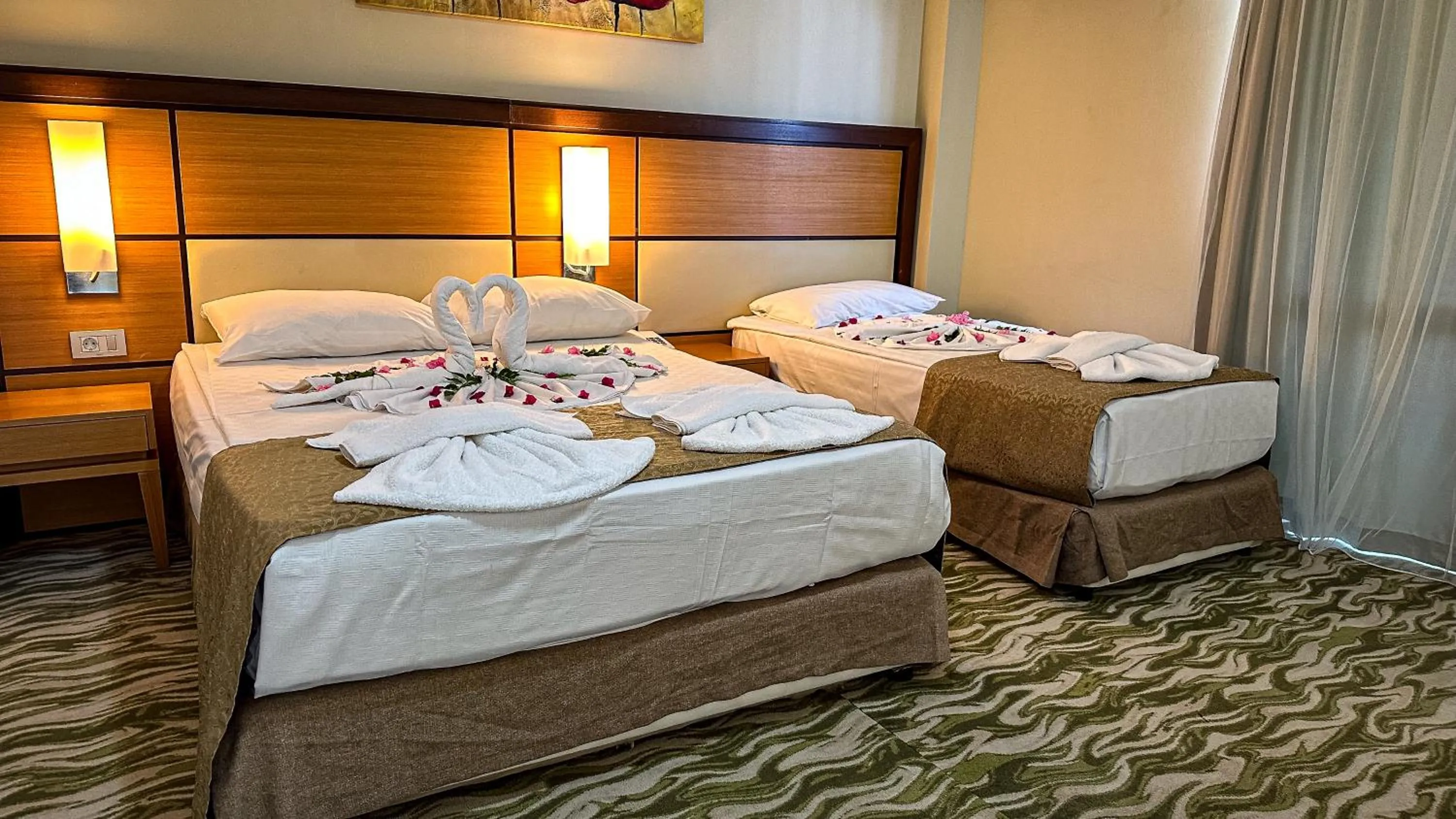 Bed in Prenses Sealine Beach Hotel
