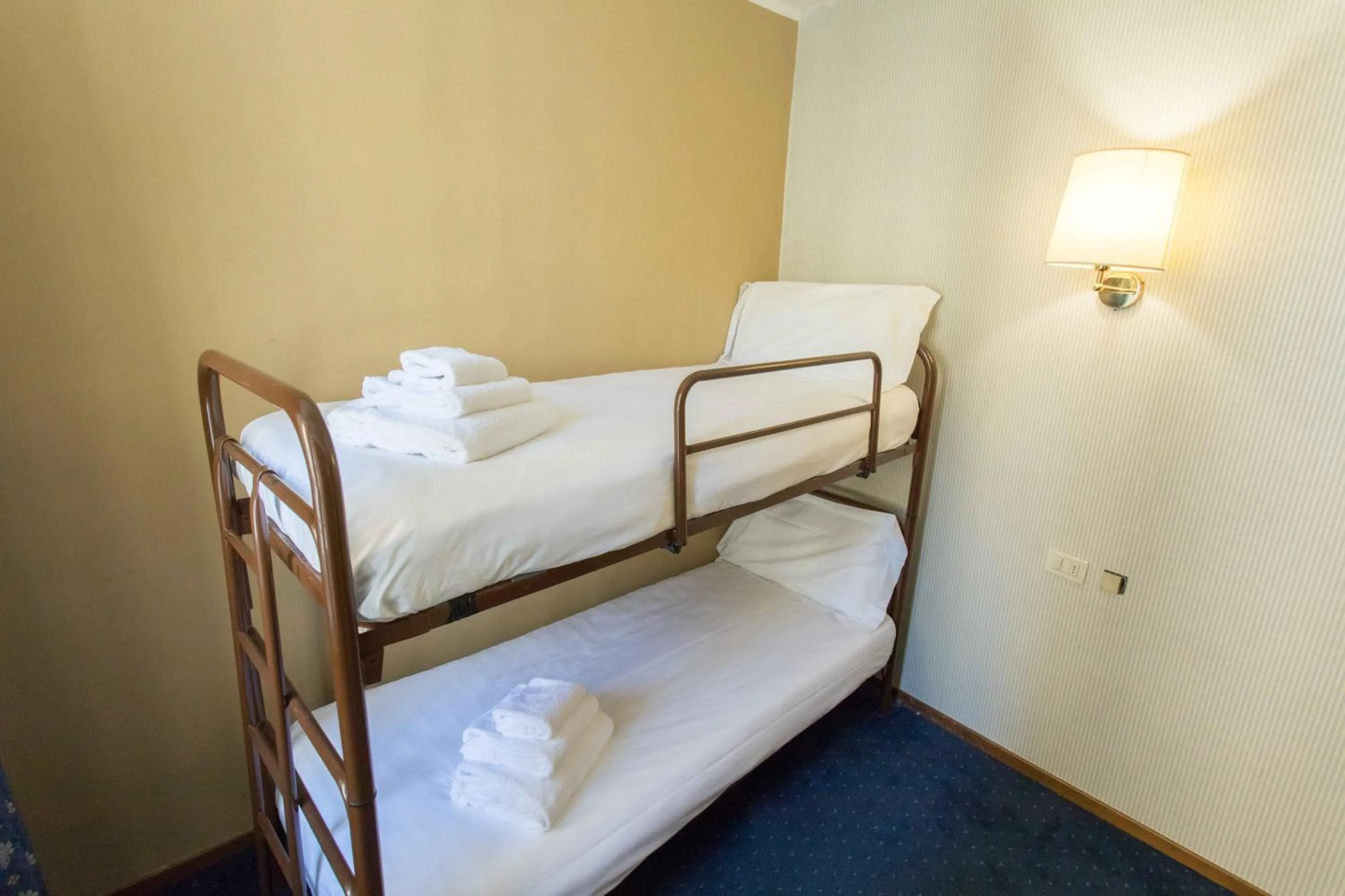 Bed in Hotel L'Aretino