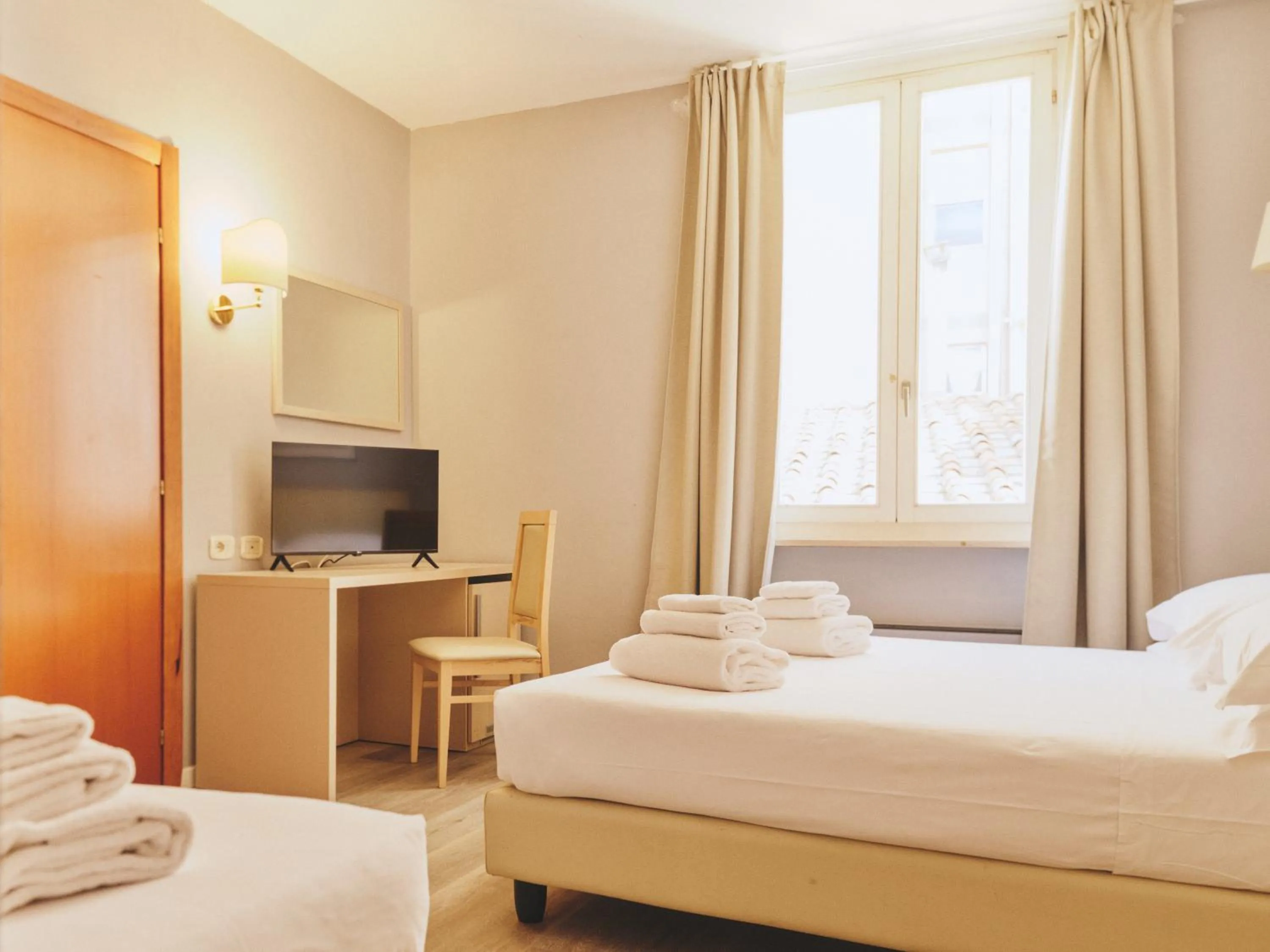 Bed in Hotel L'Aretino