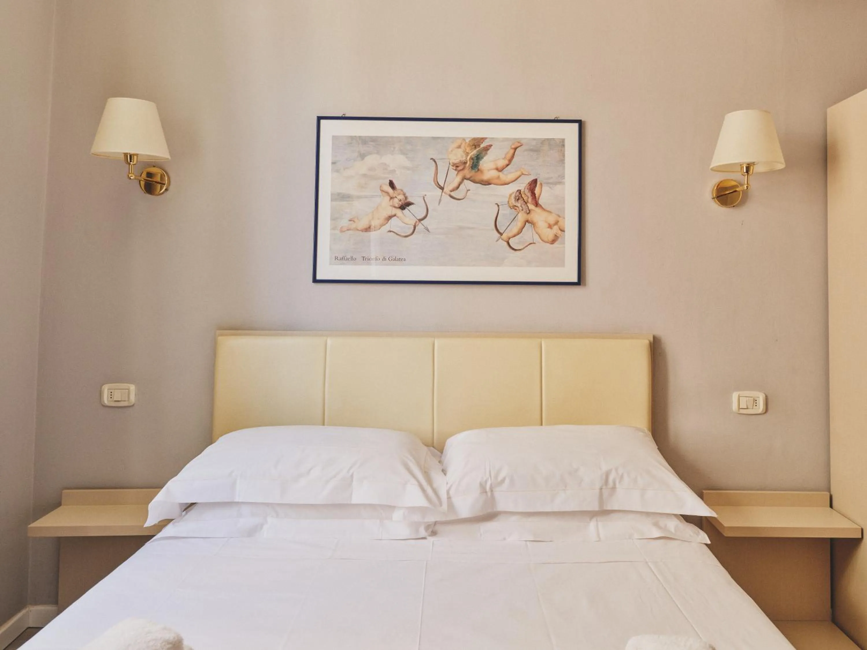 Bed in Hotel L'Aretino