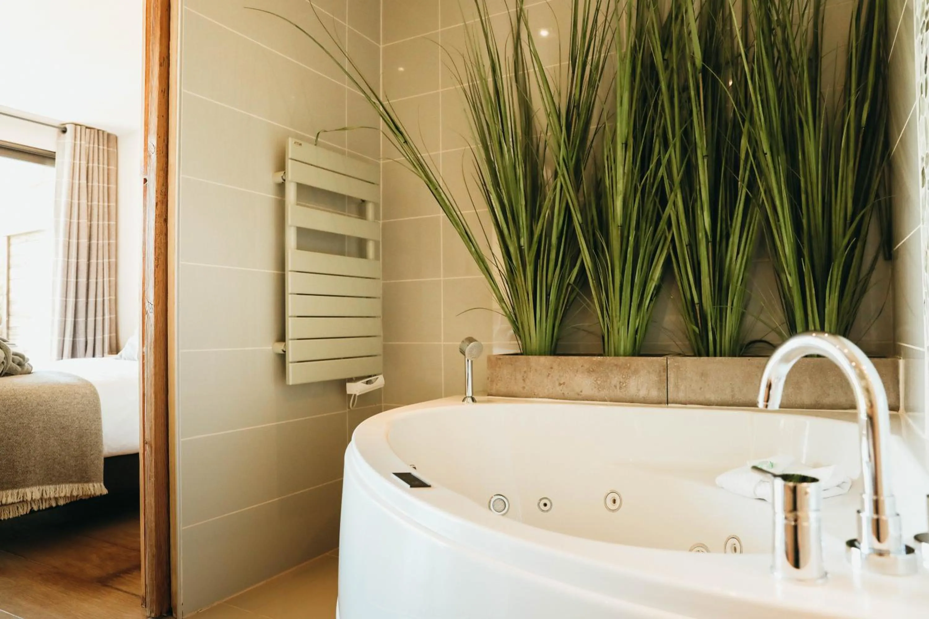 Bathroom, Bed in Les Grands Montets Hotel & Spa