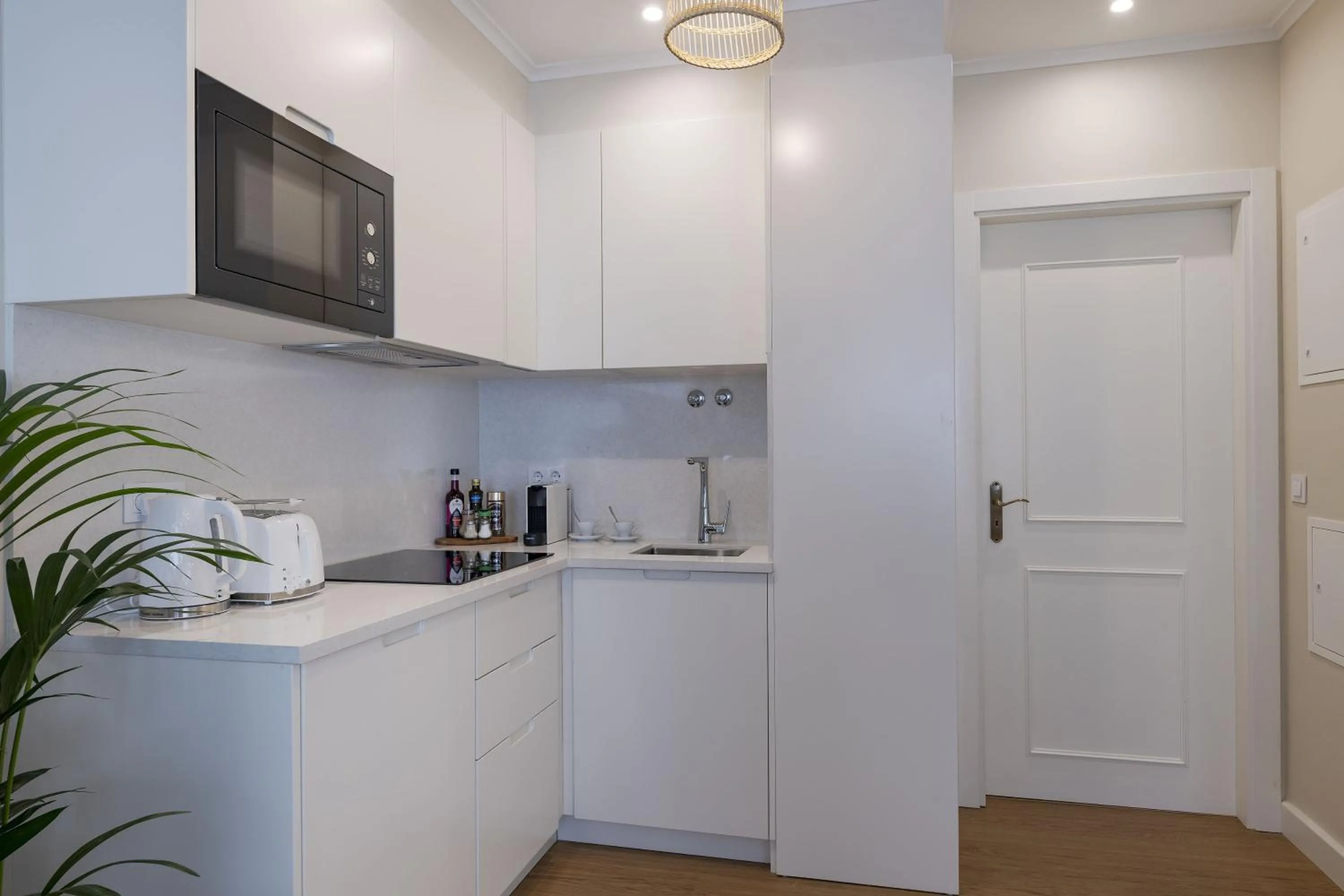 Kitchen or kitchenette in Peixeira Studios and Apartments
