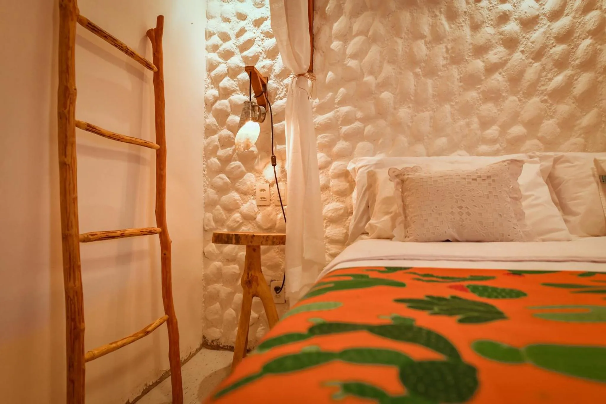 Bed in EcoCharme Pousada Netuno