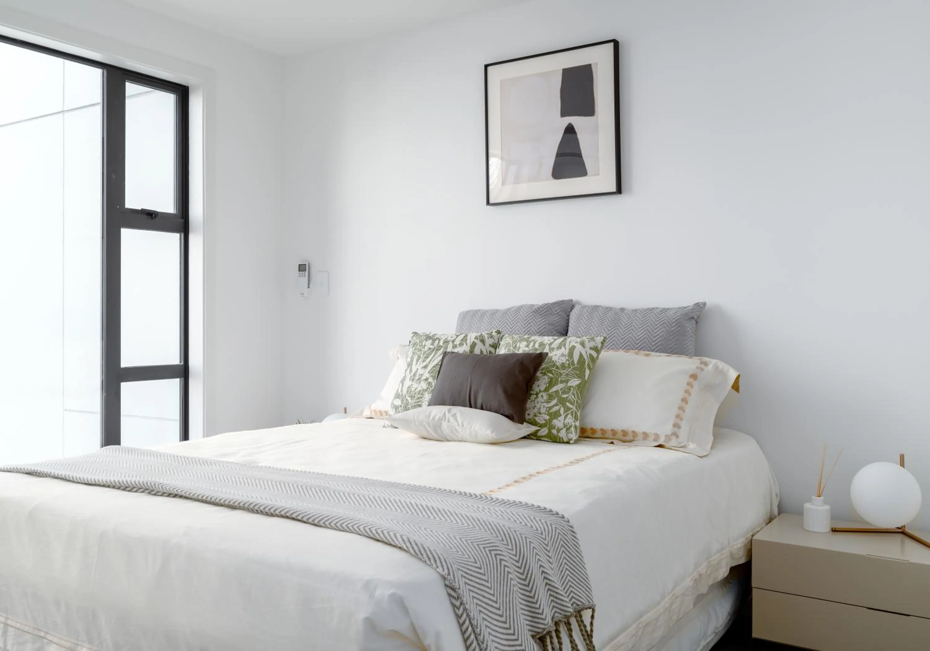 Bed in Sunrise Garden Suites