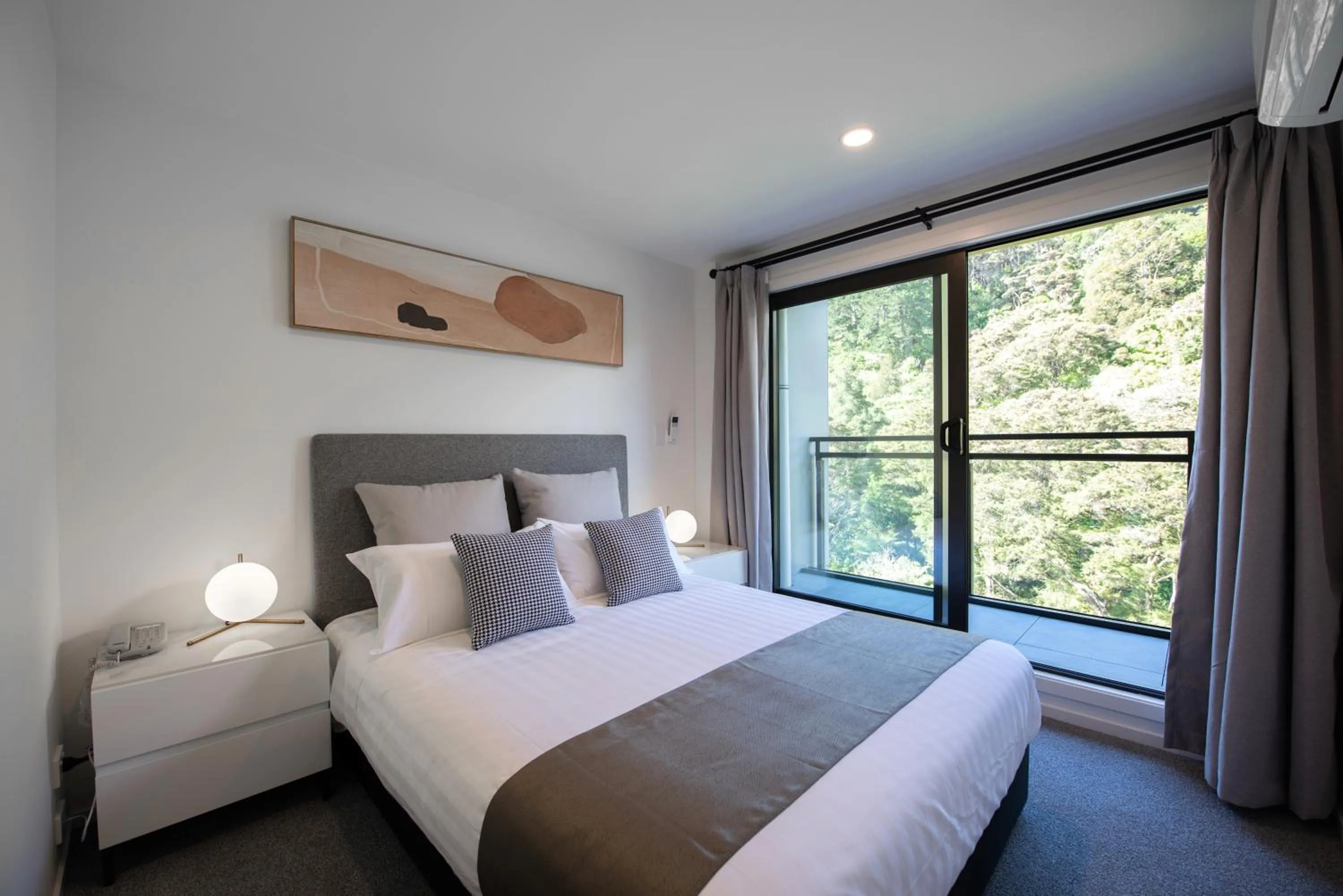 Bed in Sunrise Garden Suites