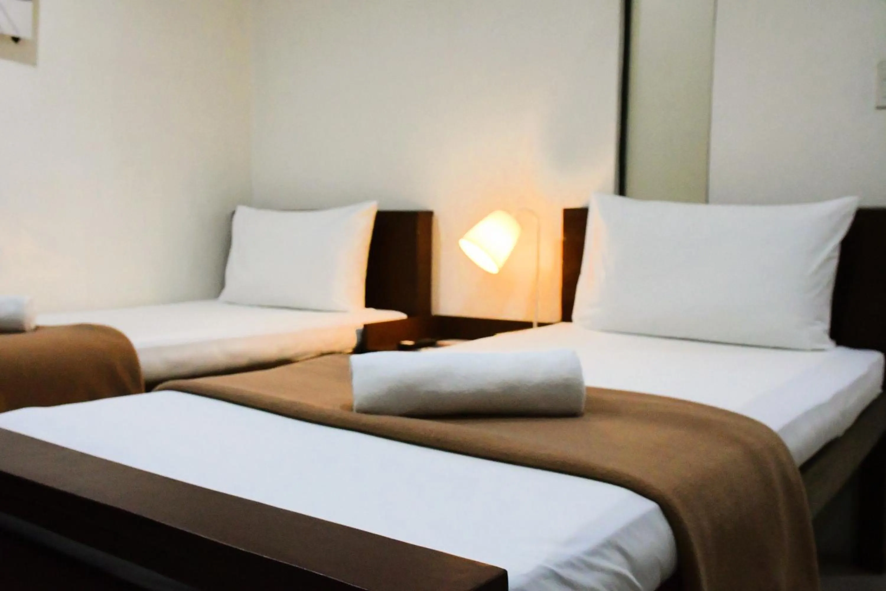 Bed in Arzo Hotel Makati
