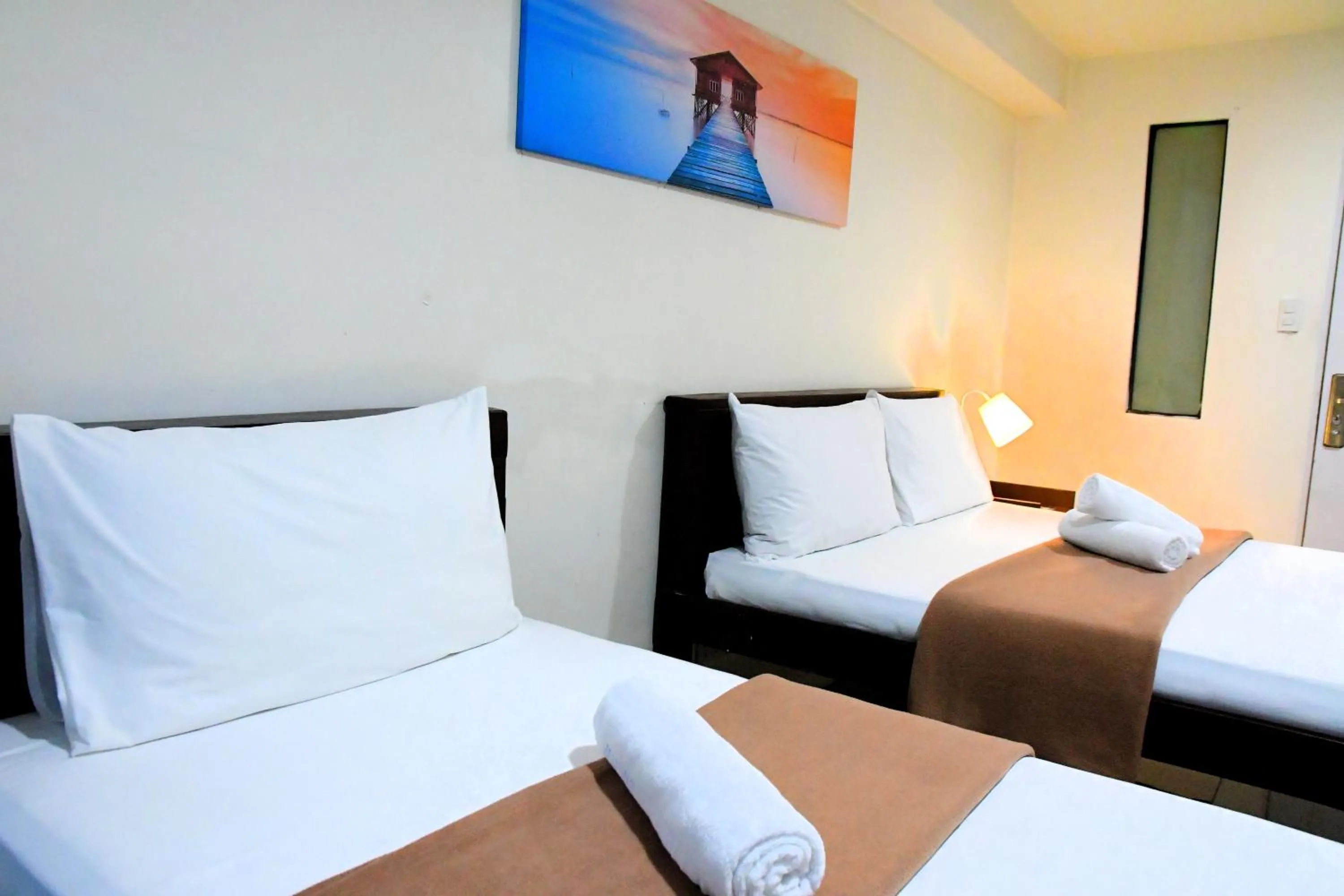 Bed in Arzo Hotel Makati