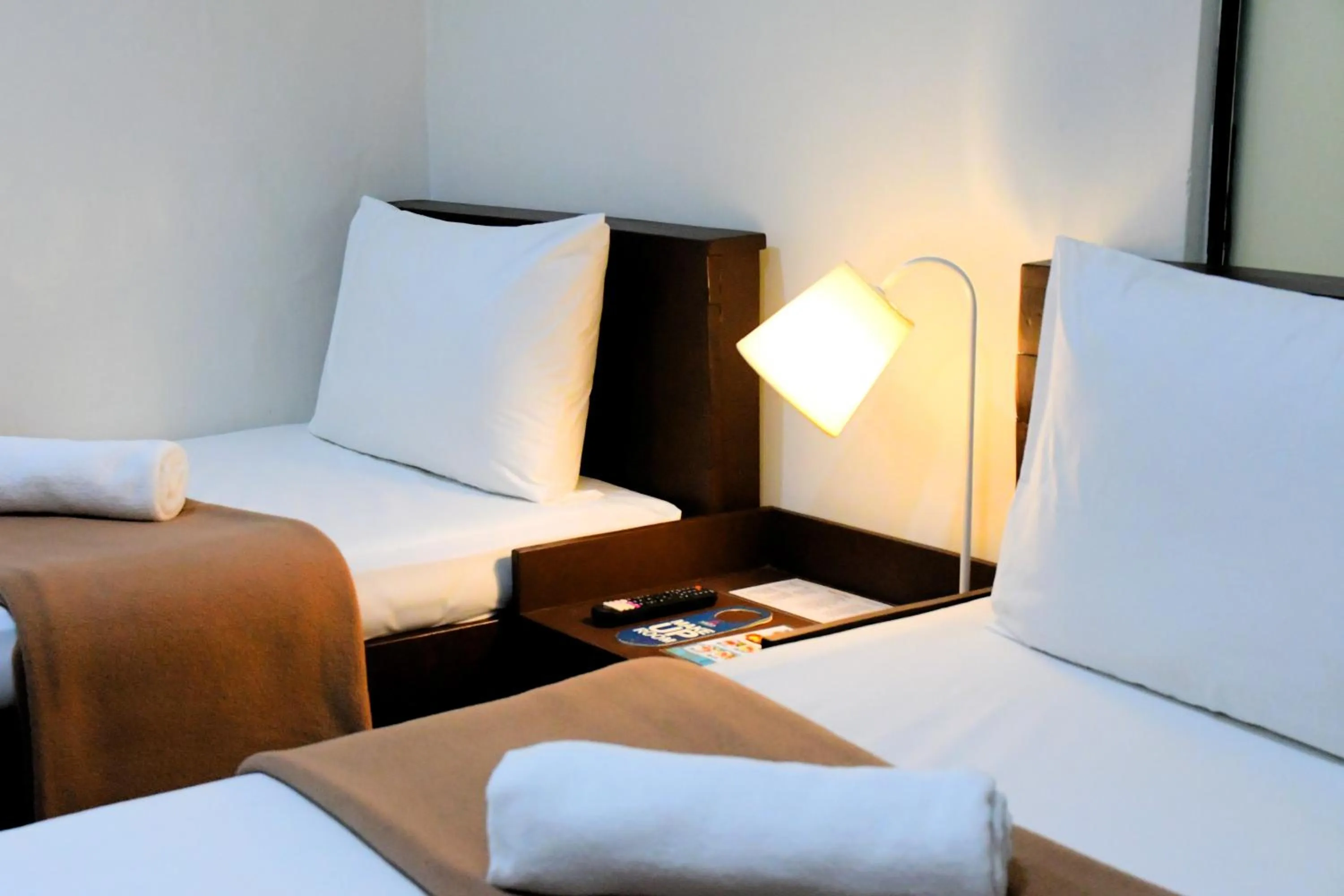 Bed in Arzo Hotel Makati