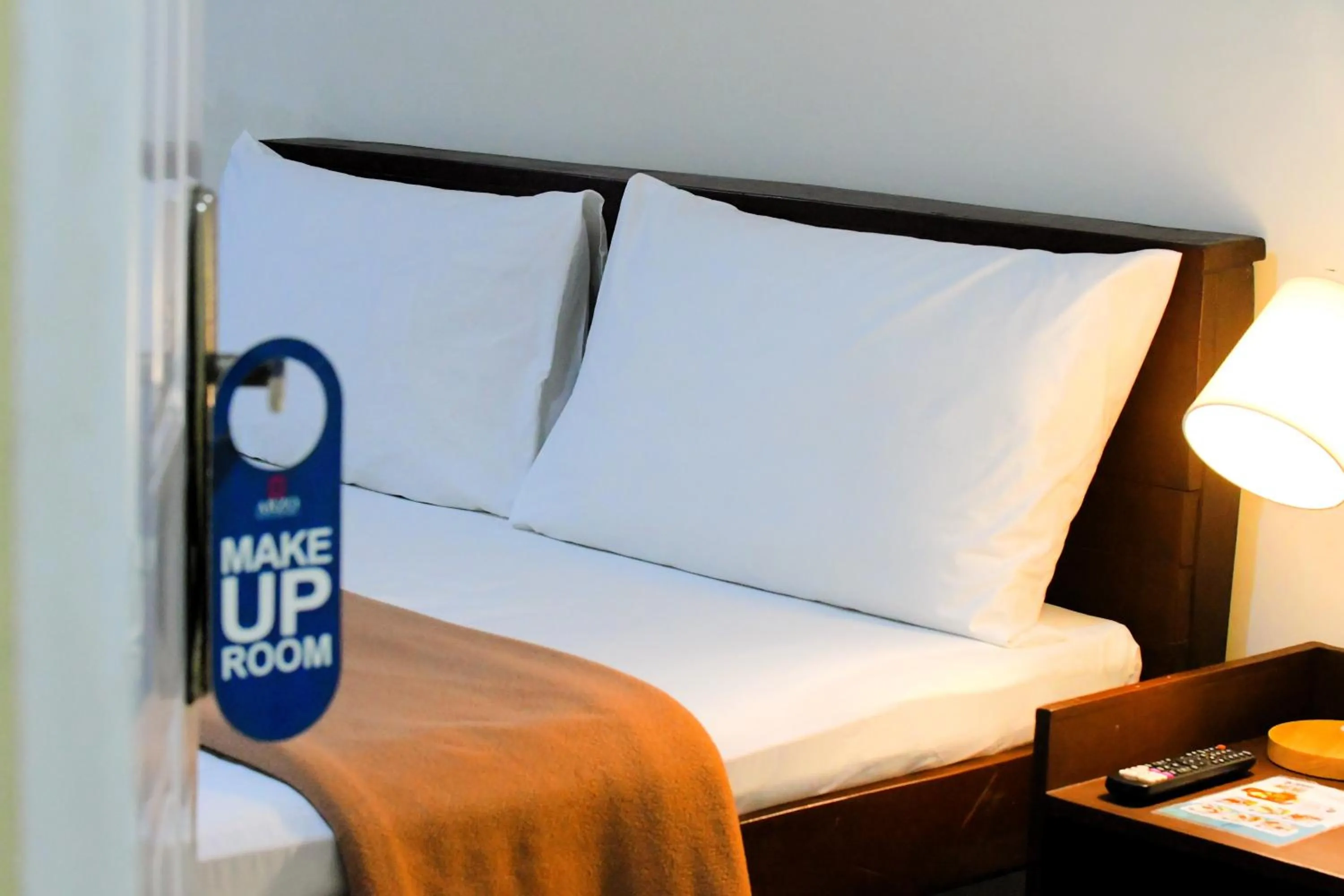 Bed in Arzo Hotel Makati