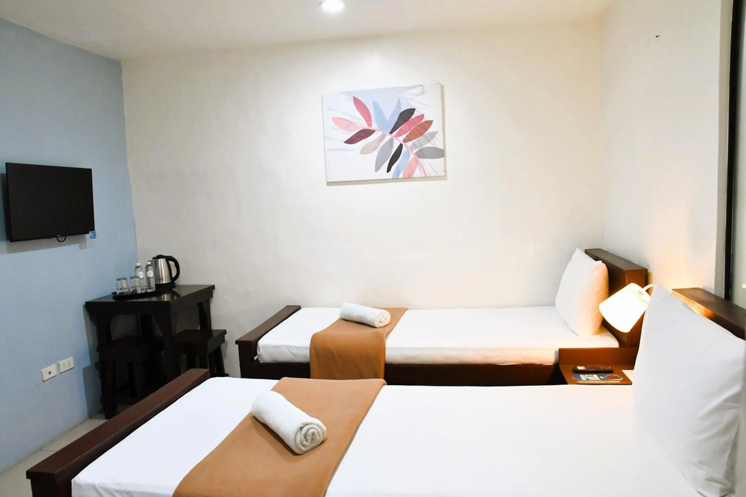 Bed in Arzo Hotel Makati