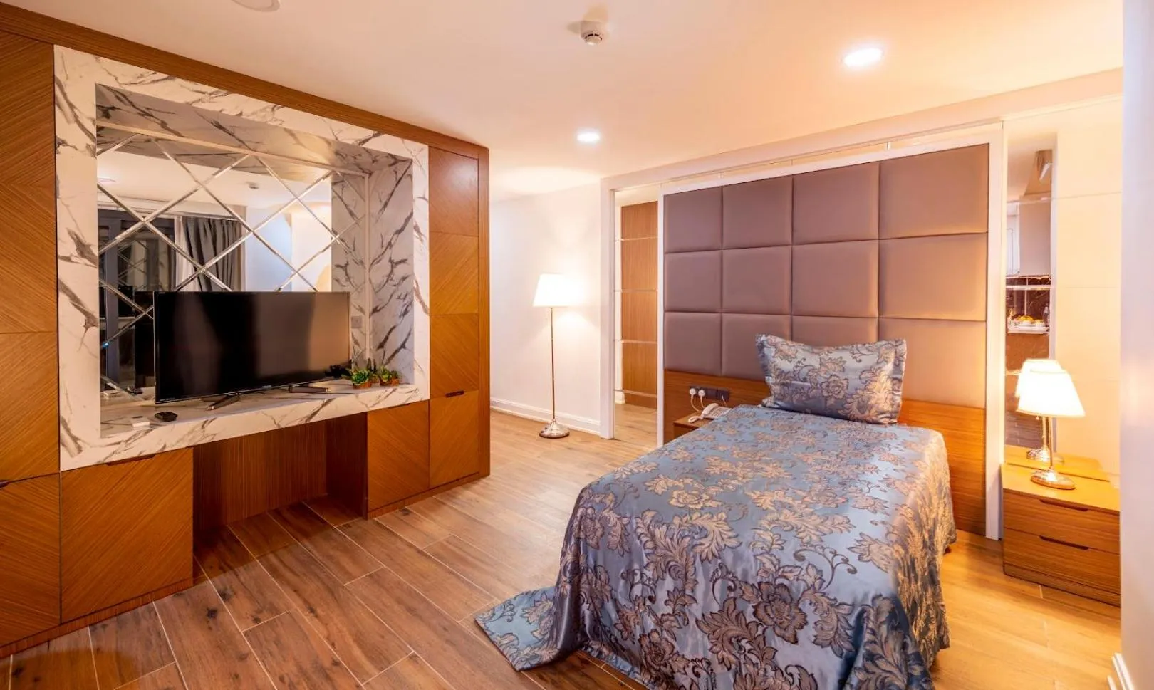 Bed in Novel Centre Point Hotel