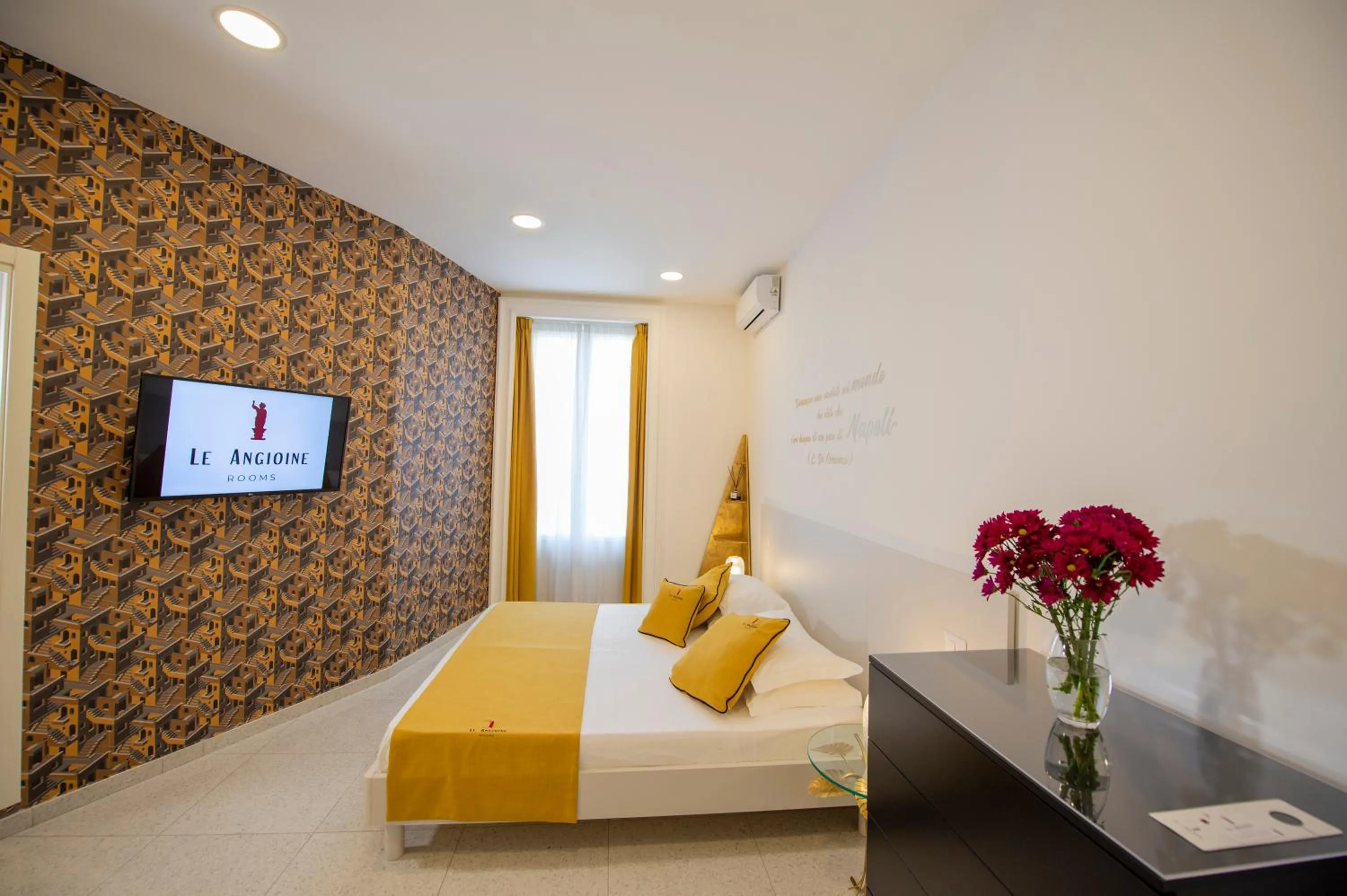 Bed in Le Angioine Rooms