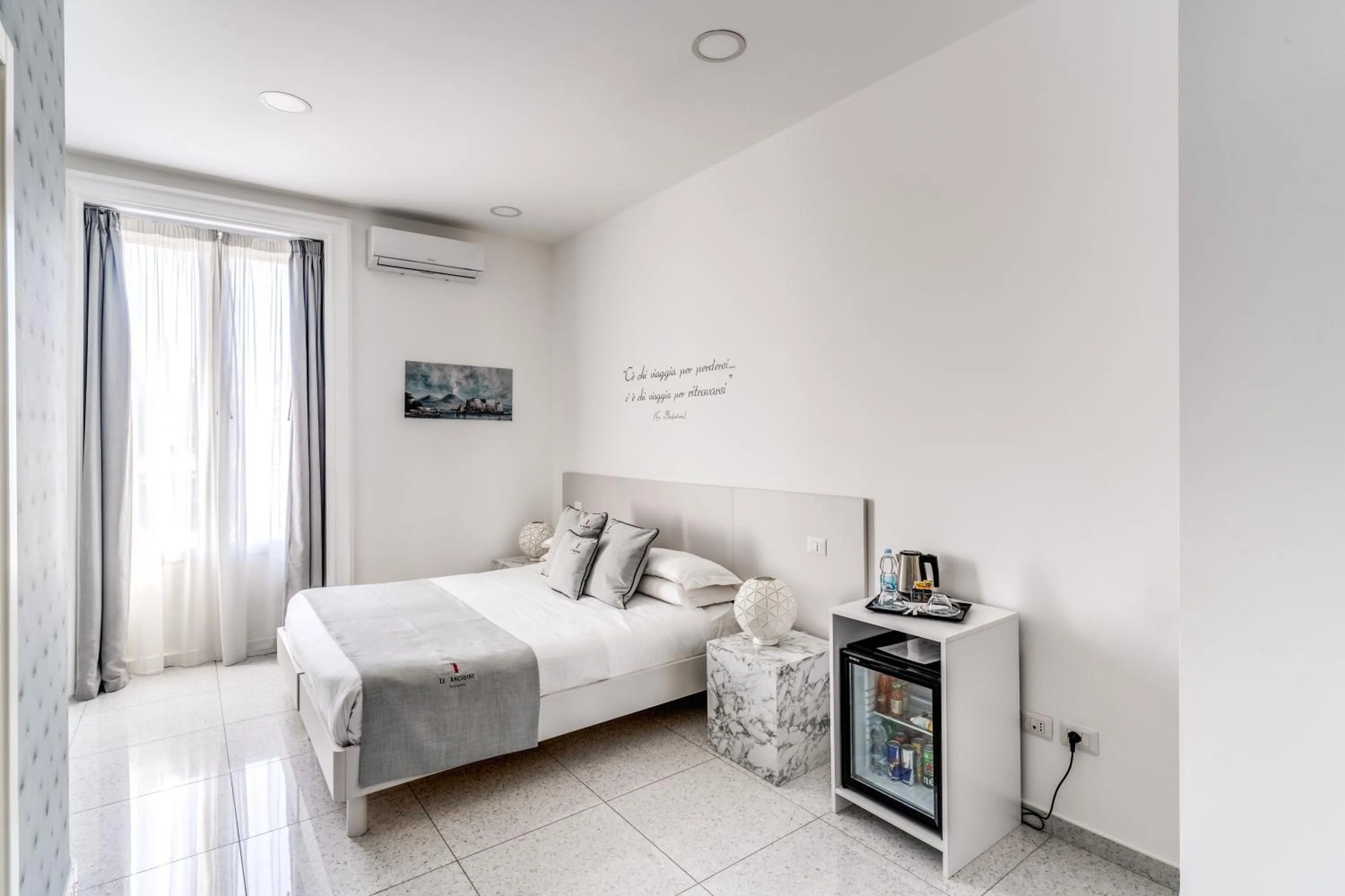 Bed in Le Angioine Rooms