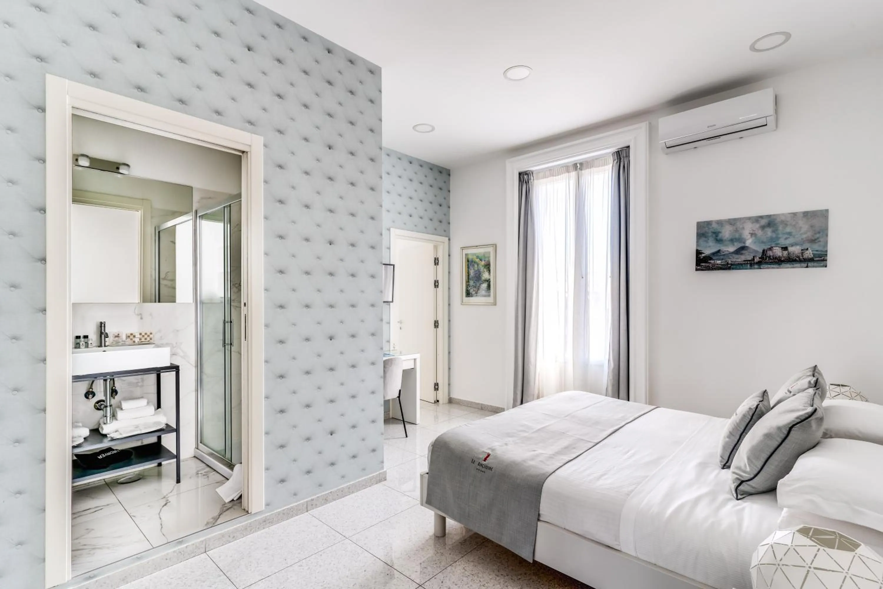 Bed in Le Angioine Rooms