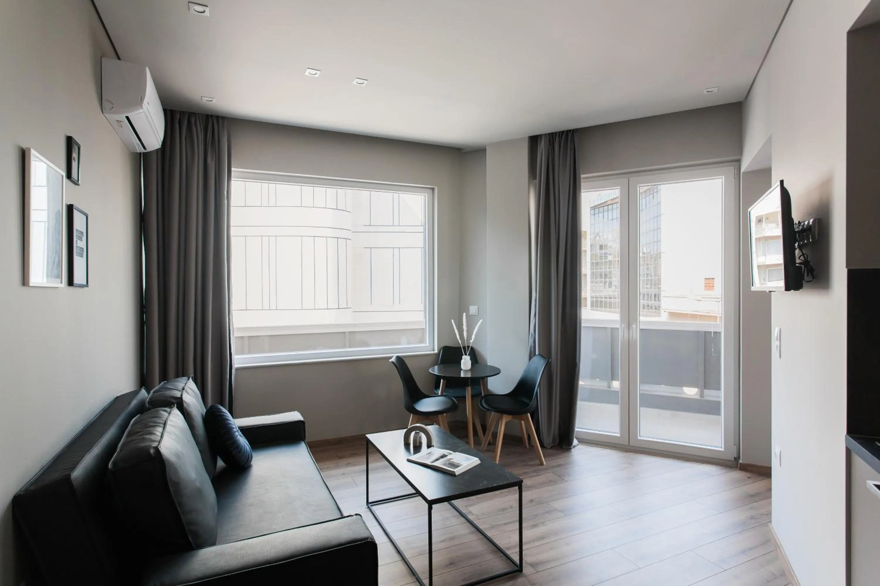 Living room in WYZ Athens Apartments by UPSTREET