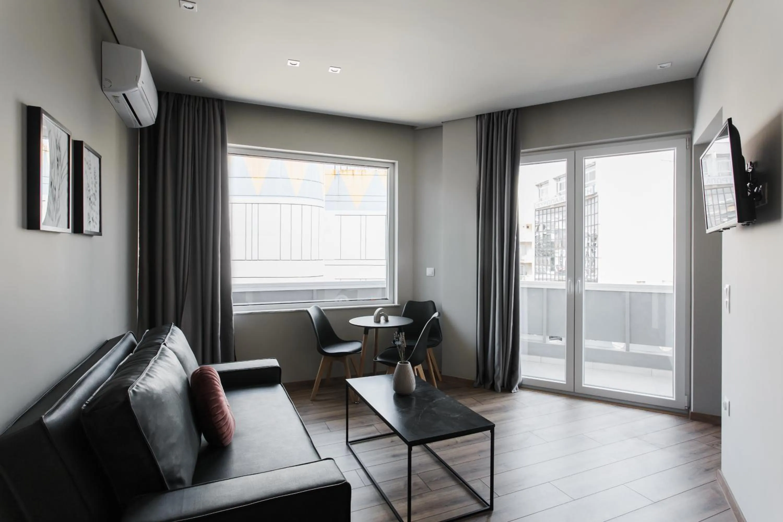 TV and multimedia in WYZ Athens Apartments by UPSTREET