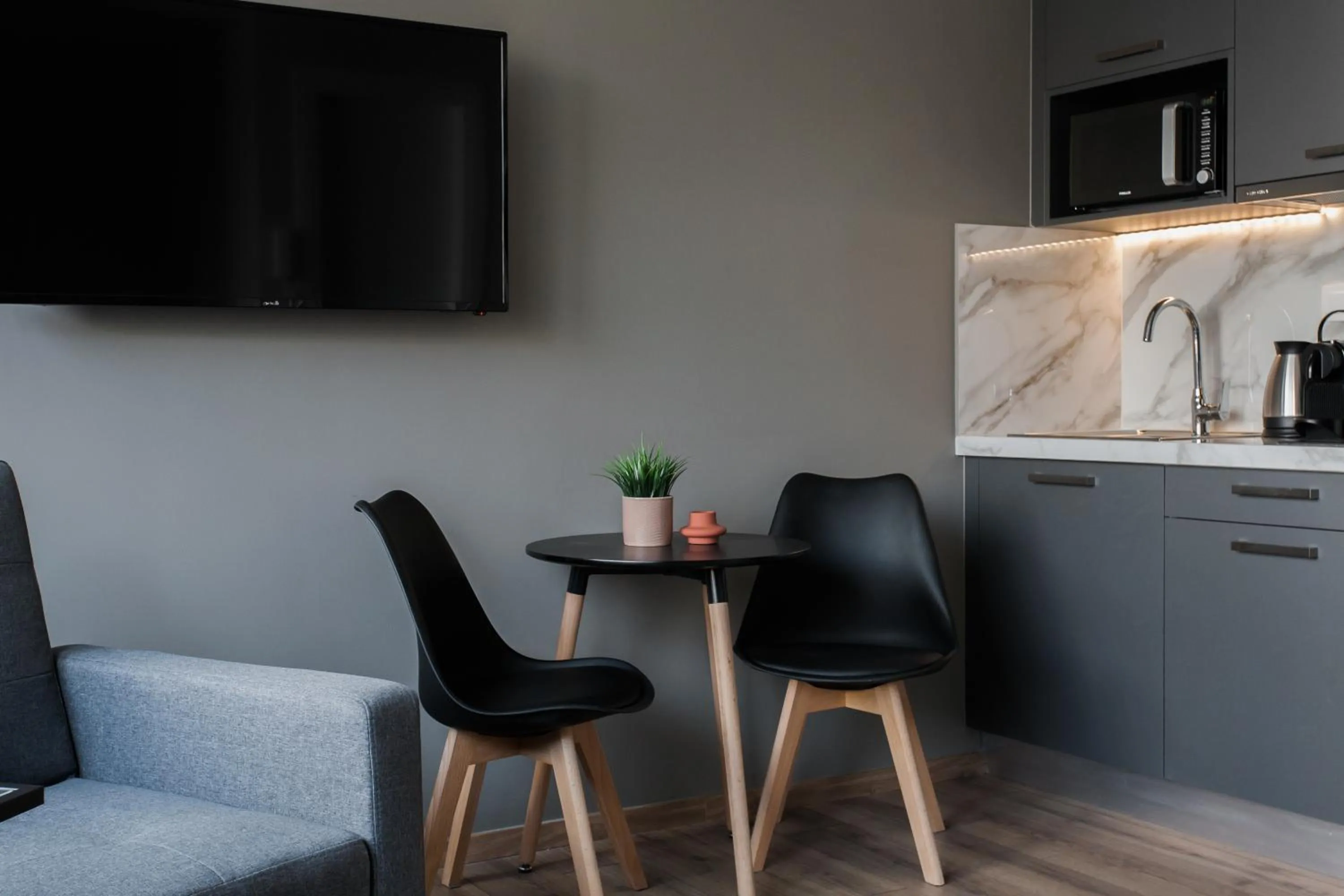 Seating area in WYZ Athens Apartments by UPSTREET