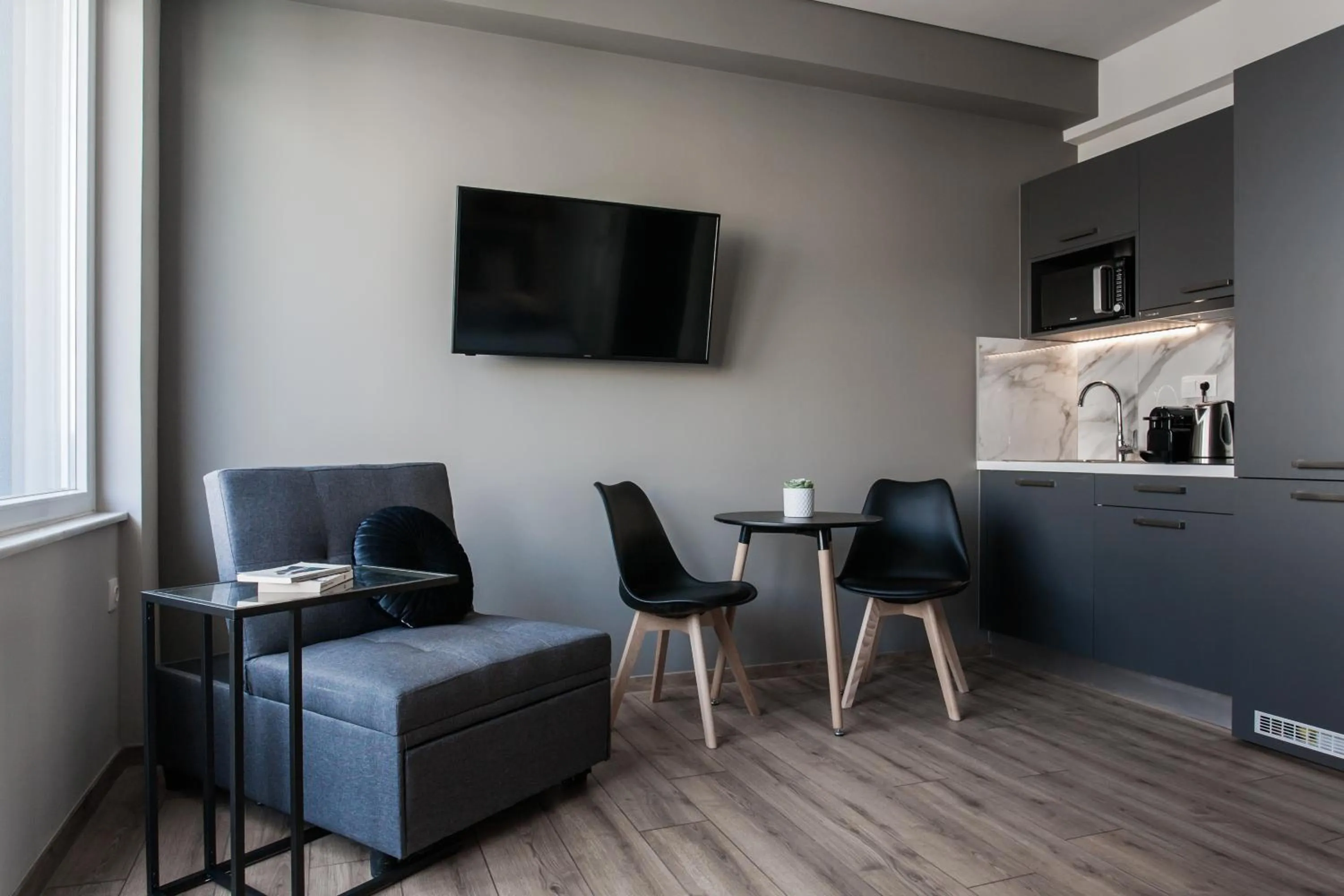 TV and multimedia in WYZ Athens Apartments by UPSTREET