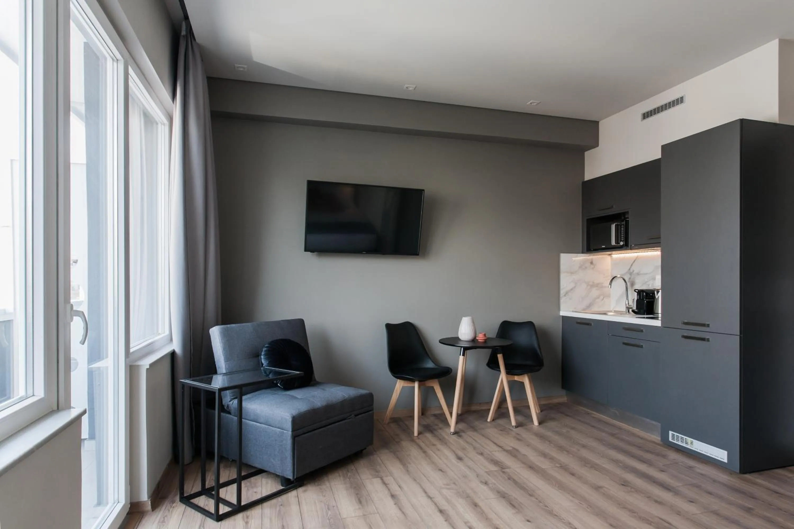 TV and multimedia in WYZ Athens Apartments by UPSTREET