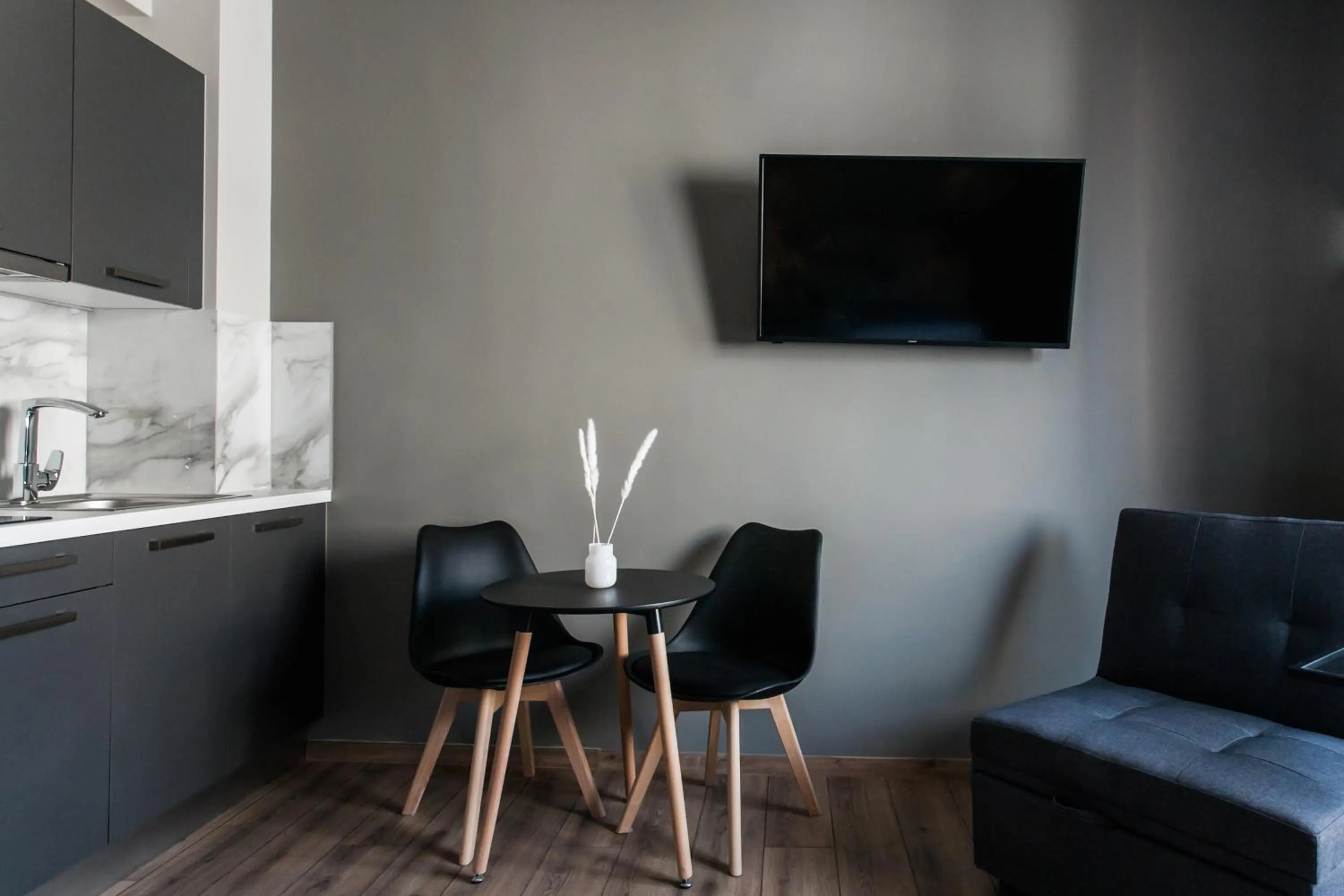 Seating area in WYZ Athens Apartments by UPSTREET