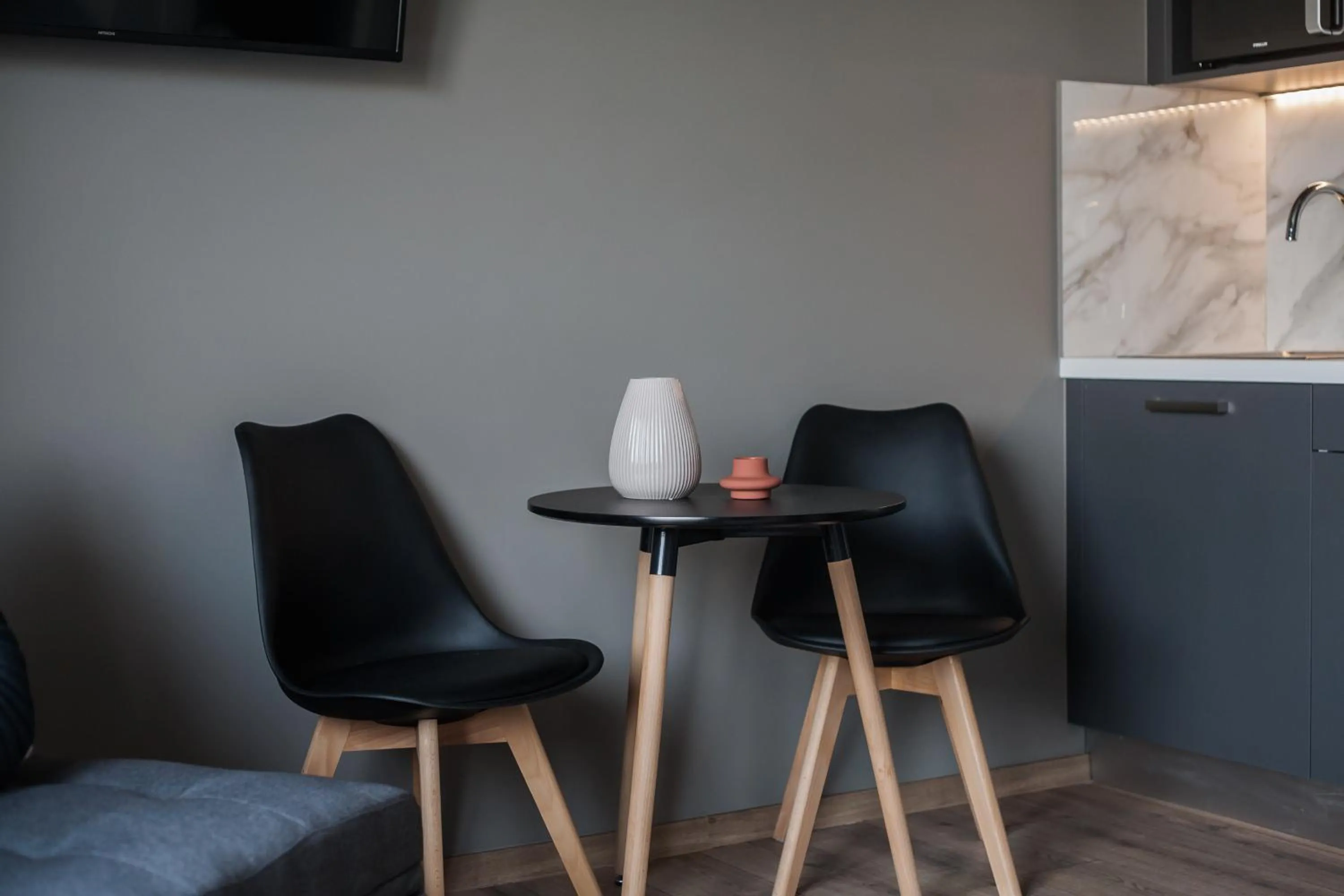 Seating area in WYZ Athens Apartments by UPSTREET