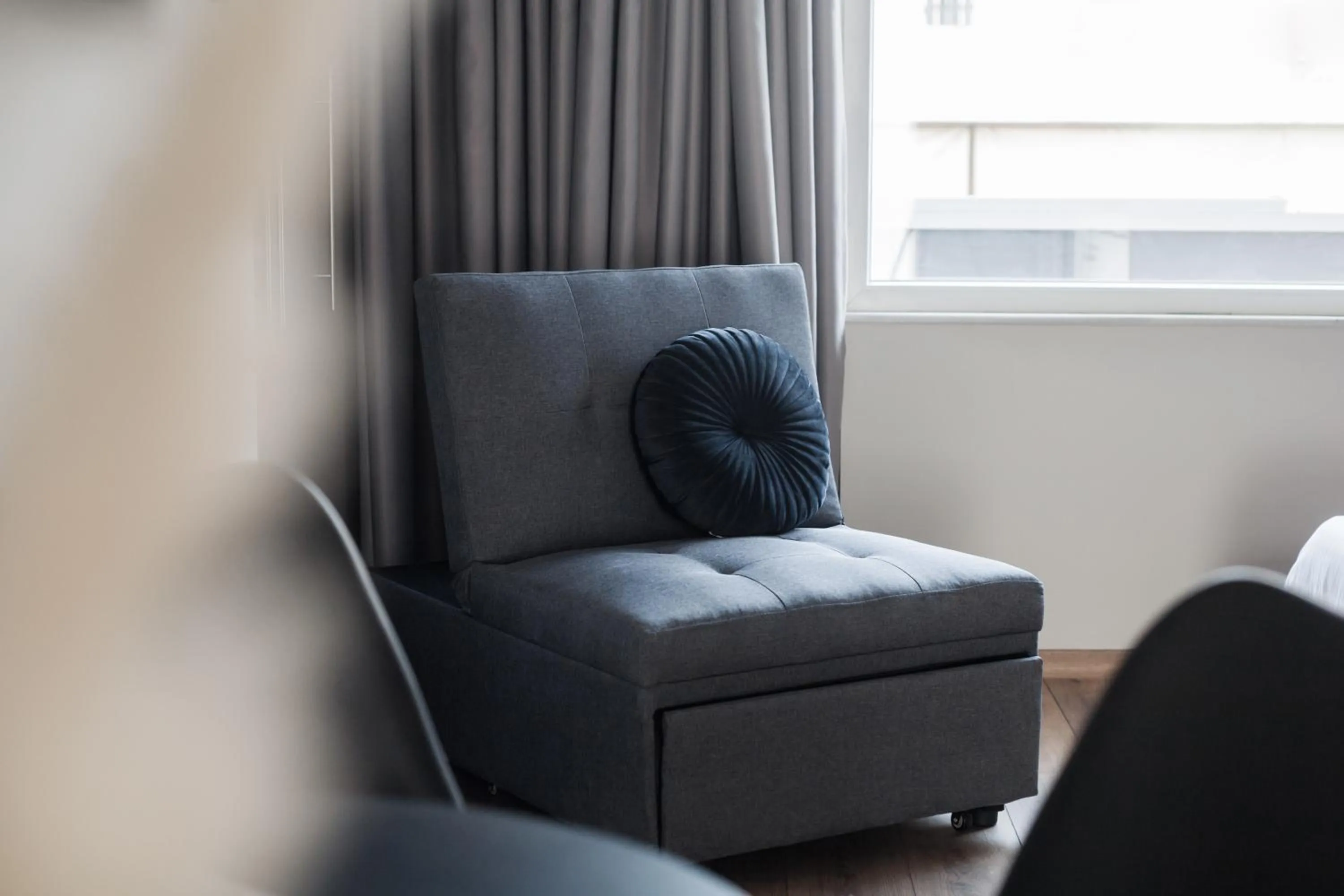 Seating area in WYZ Athens Apartments by UPSTREET