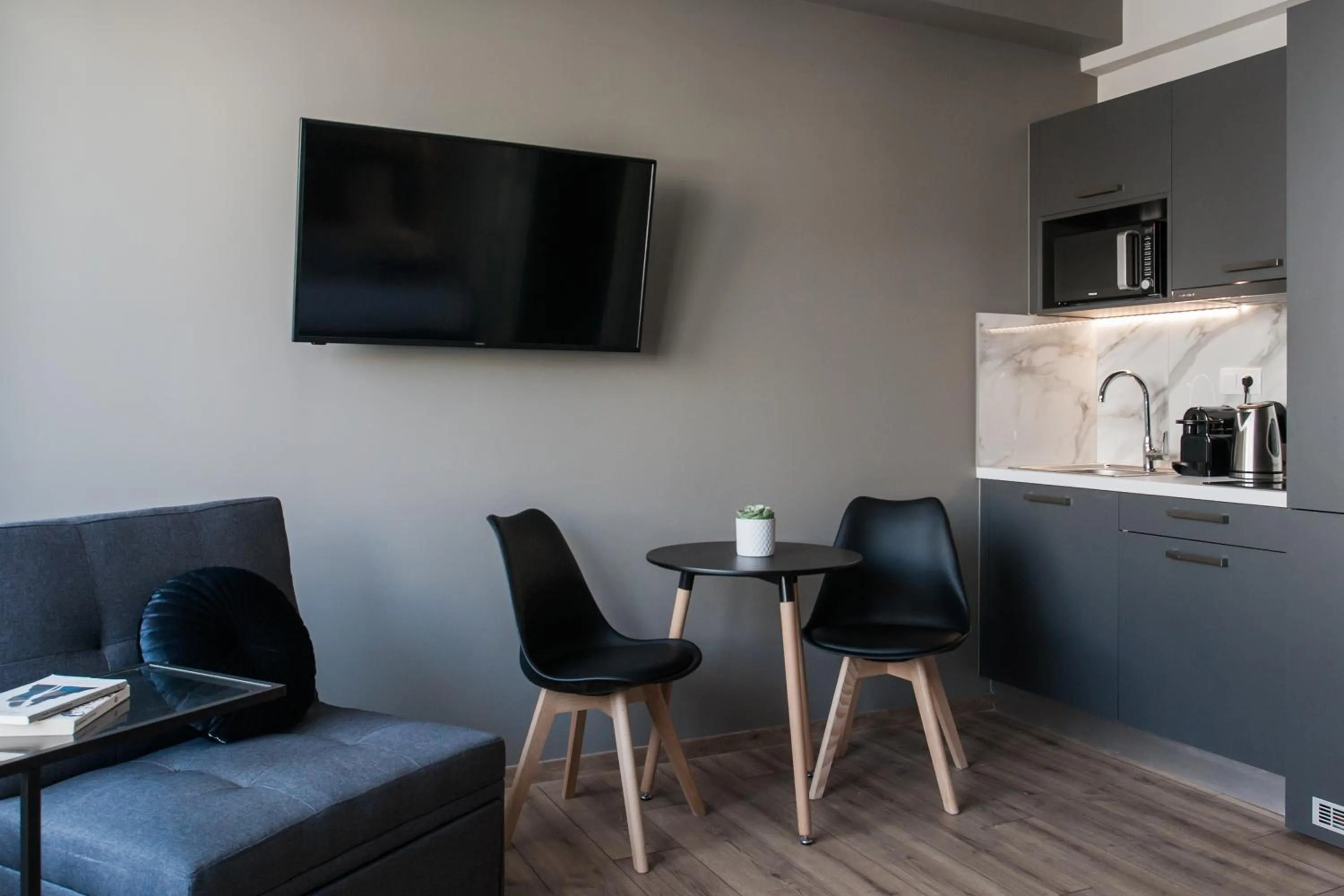 TV and multimedia in WYZ Athens Apartments by UPSTREET