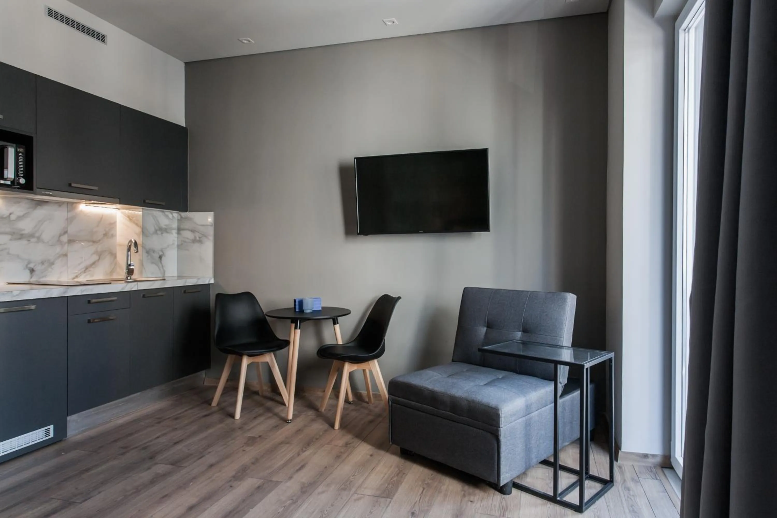 TV and multimedia in WYZ Athens Apartments by UPSTREET