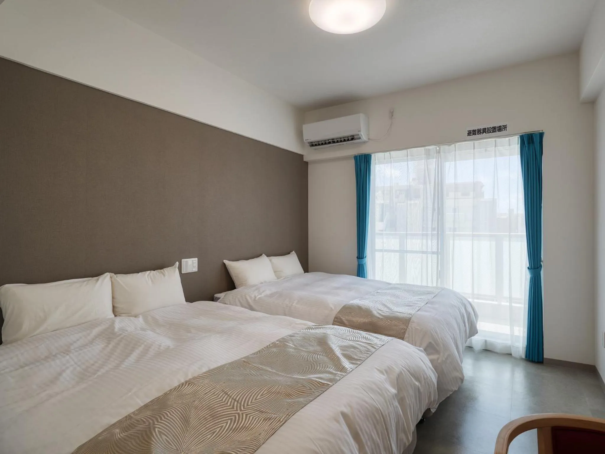 Bed in BiBi Hotel NAHA KUME