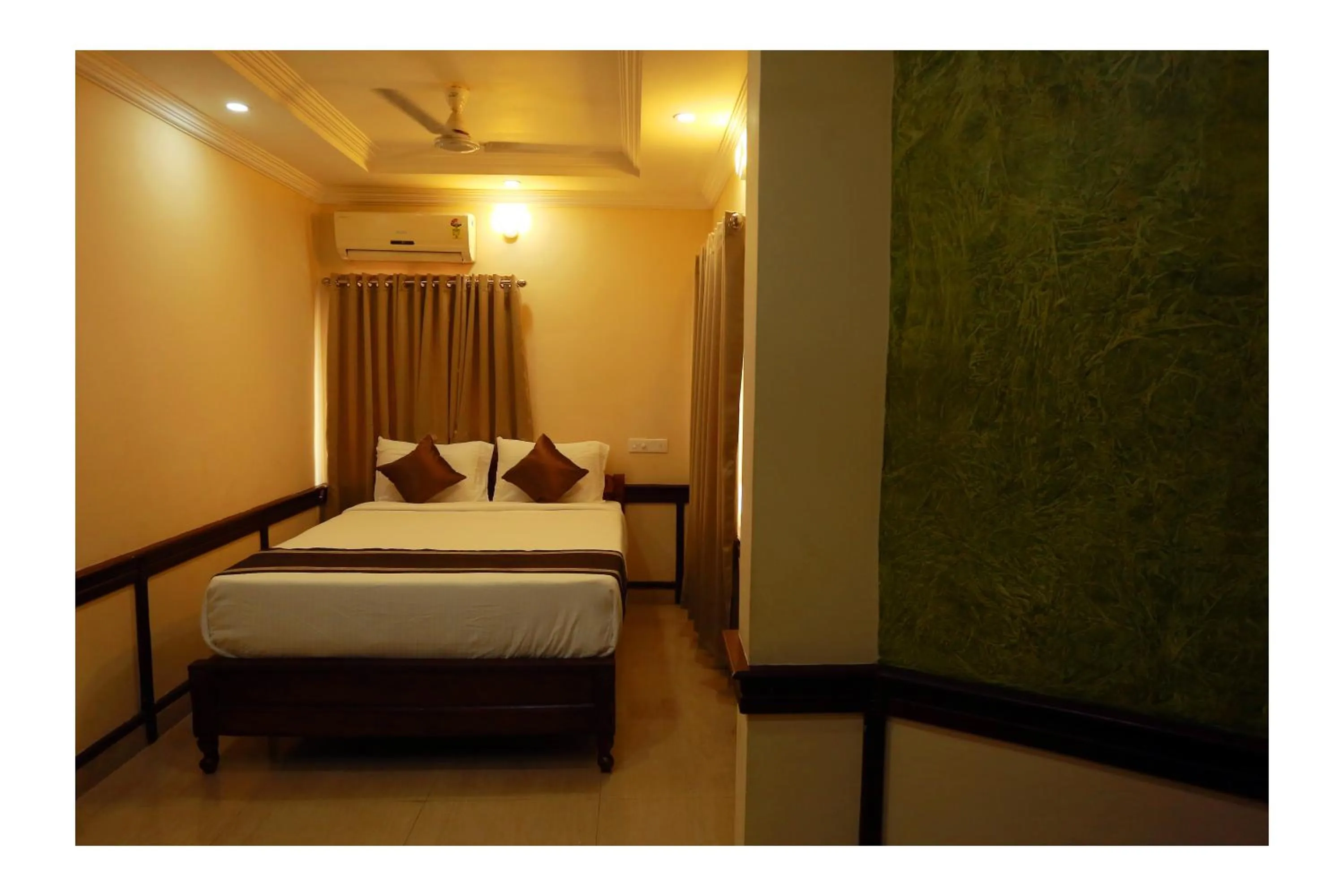 Bed in CORRIDOR CALICUT Airport Hotel