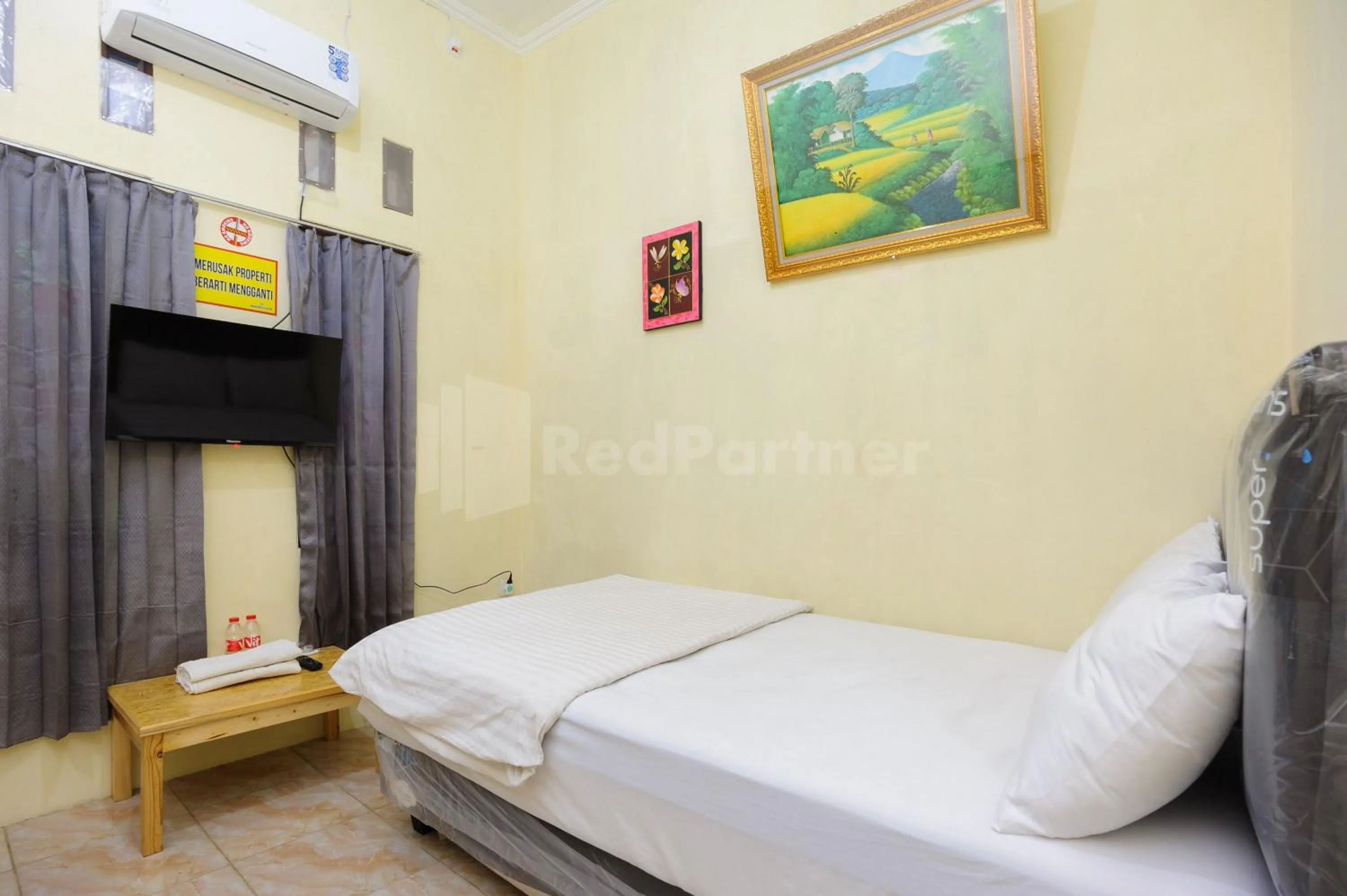 Bed in OYO 90594 Fajar Inn