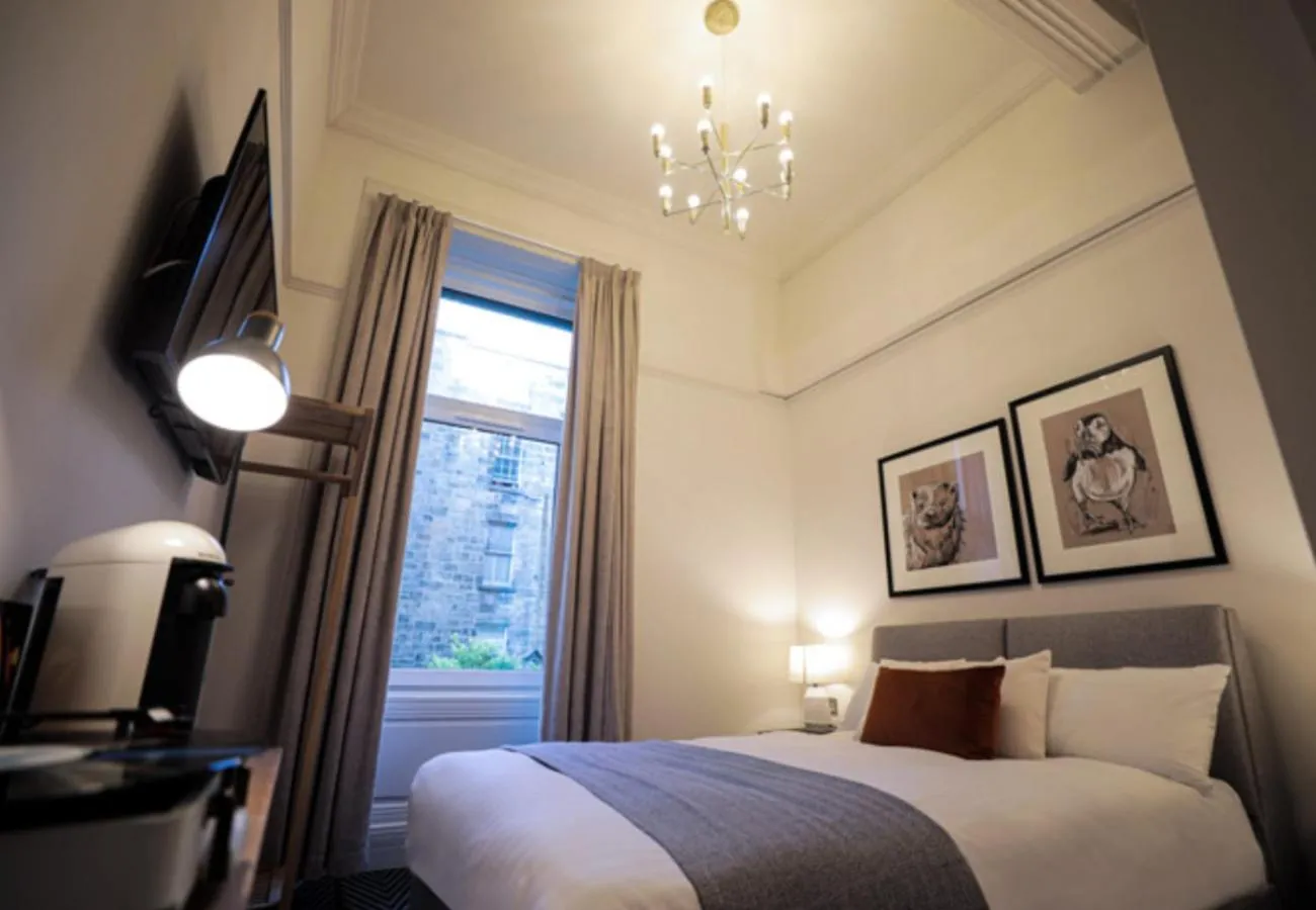 Photo of the whole room, Bed in Boutique 50