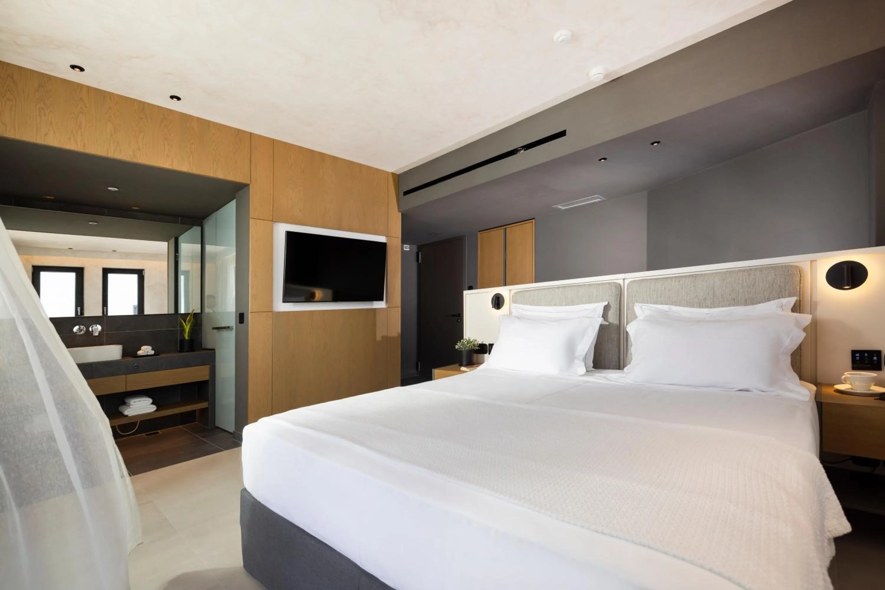 Bed in Anasa Luxury Resort