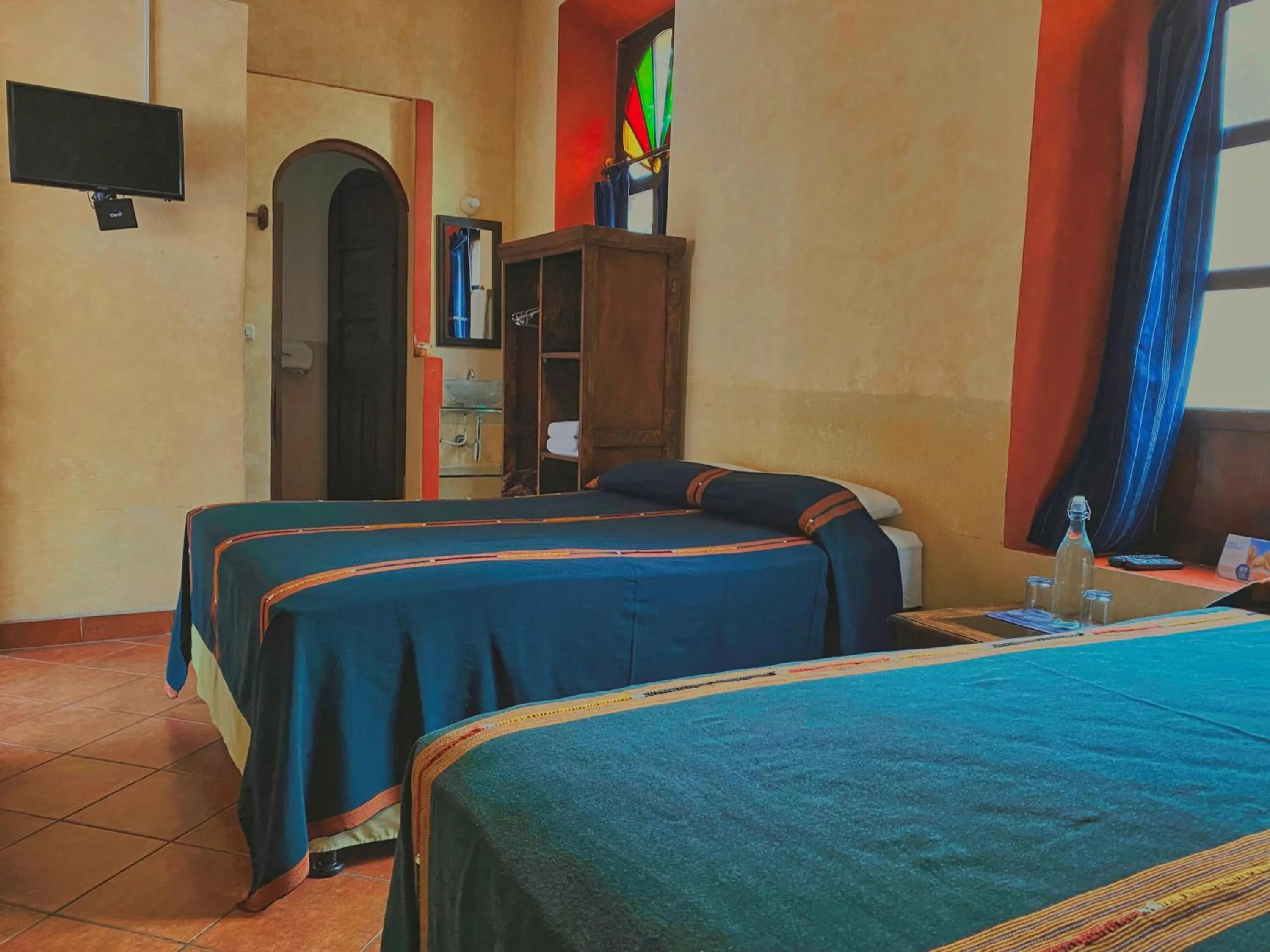 Bed in Hotel Maya Ik'