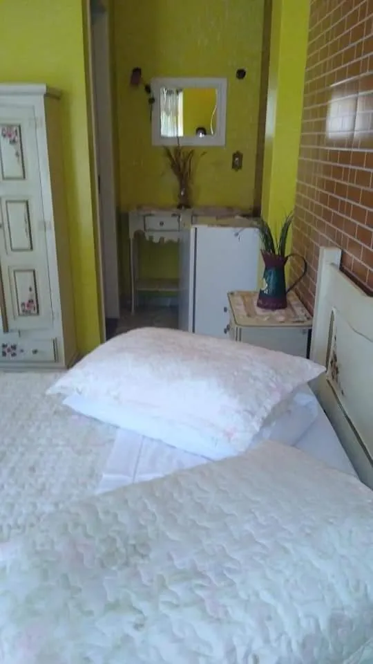 Bed in Pousada Oca Porã