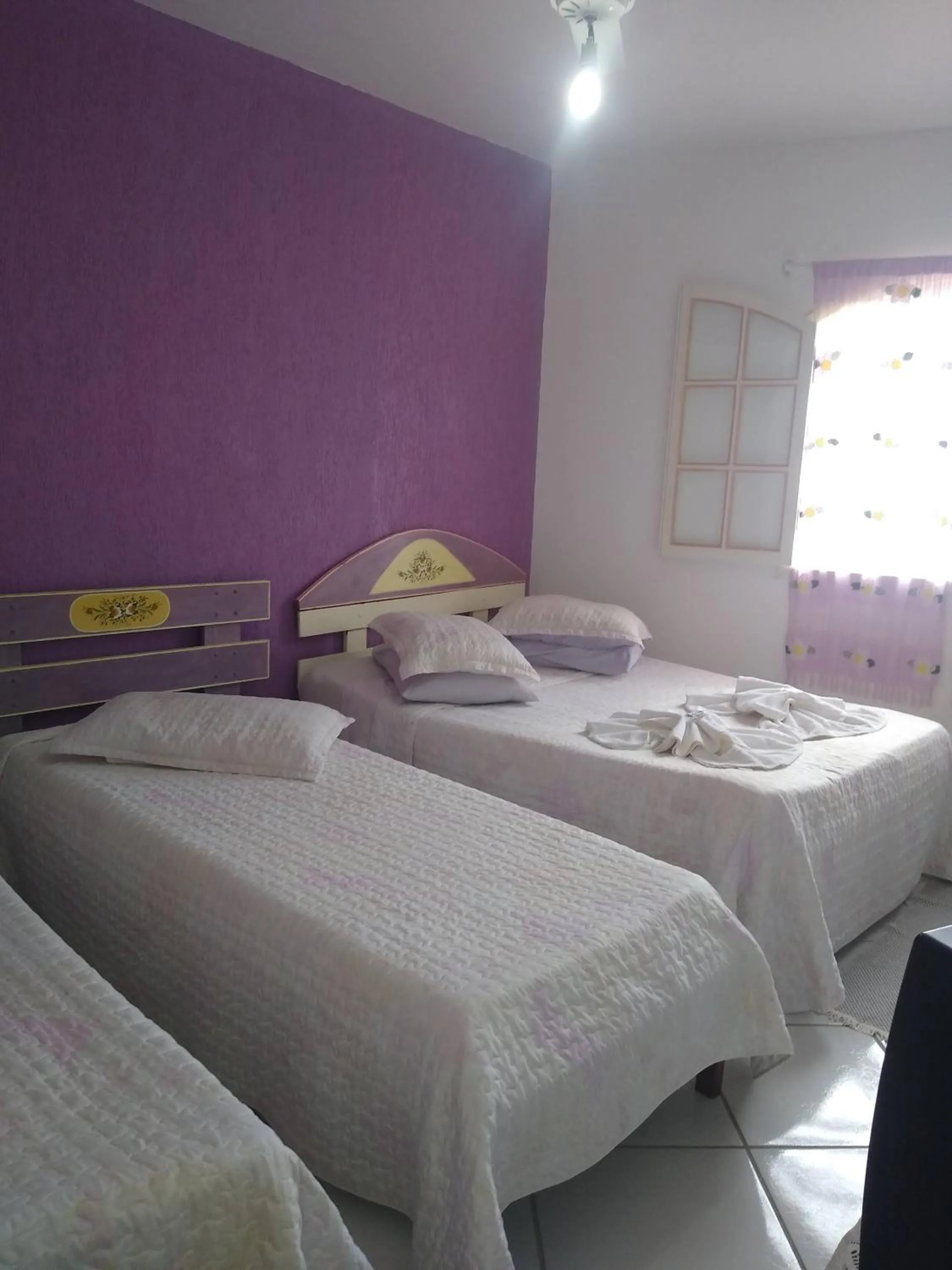 Bed in Pousada Oca Porã