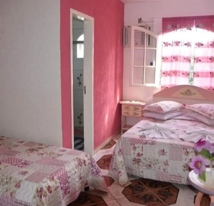Bed in Pousada Oca Porã