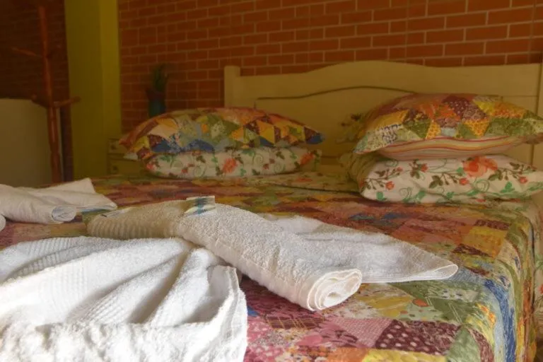 Bed in Pousada Oca Porã